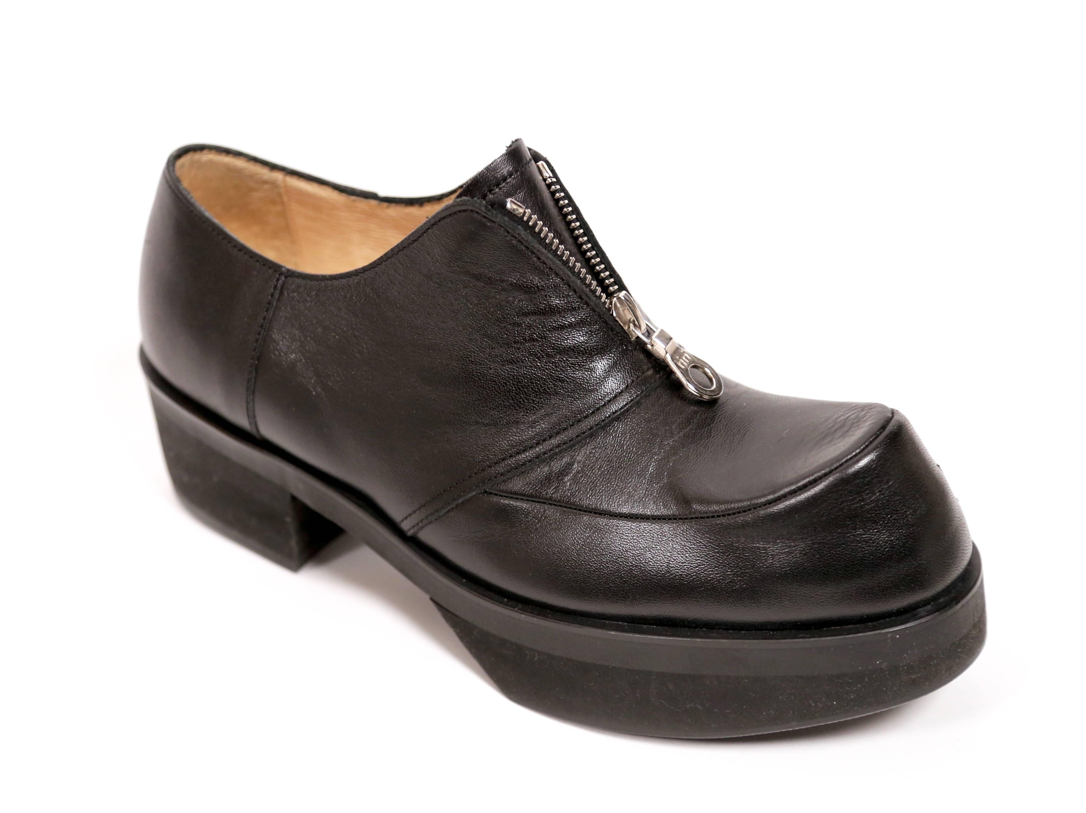 Black leather zip up oxfords with platform soles designed by Yohji Yamamoto dating to the 1990's.  Shoes can be worn with the zippers open or closed. Labeled a size 'L'. Fits approximately a US 8.5. Insoles measure 24.5cm long by 8.5cm wide. Heels