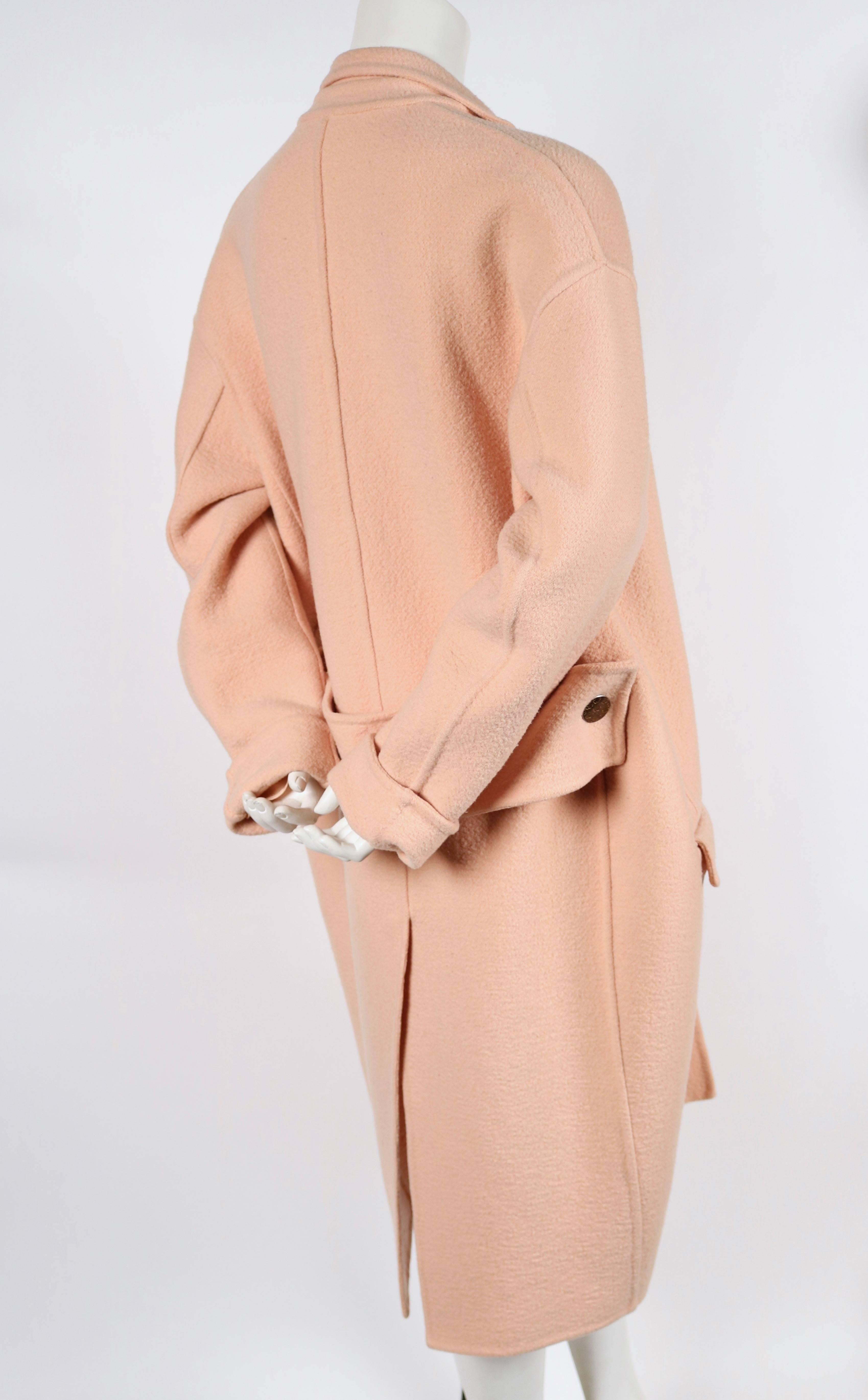 Very rare and highly documented blush colored cashmere coat designed by Phoebe Philo for Celine exactly as seen on the runway for fall of 2013. French size 34 however this is oversized cut so it fits up to a US size 6. Single button closure. Pockets