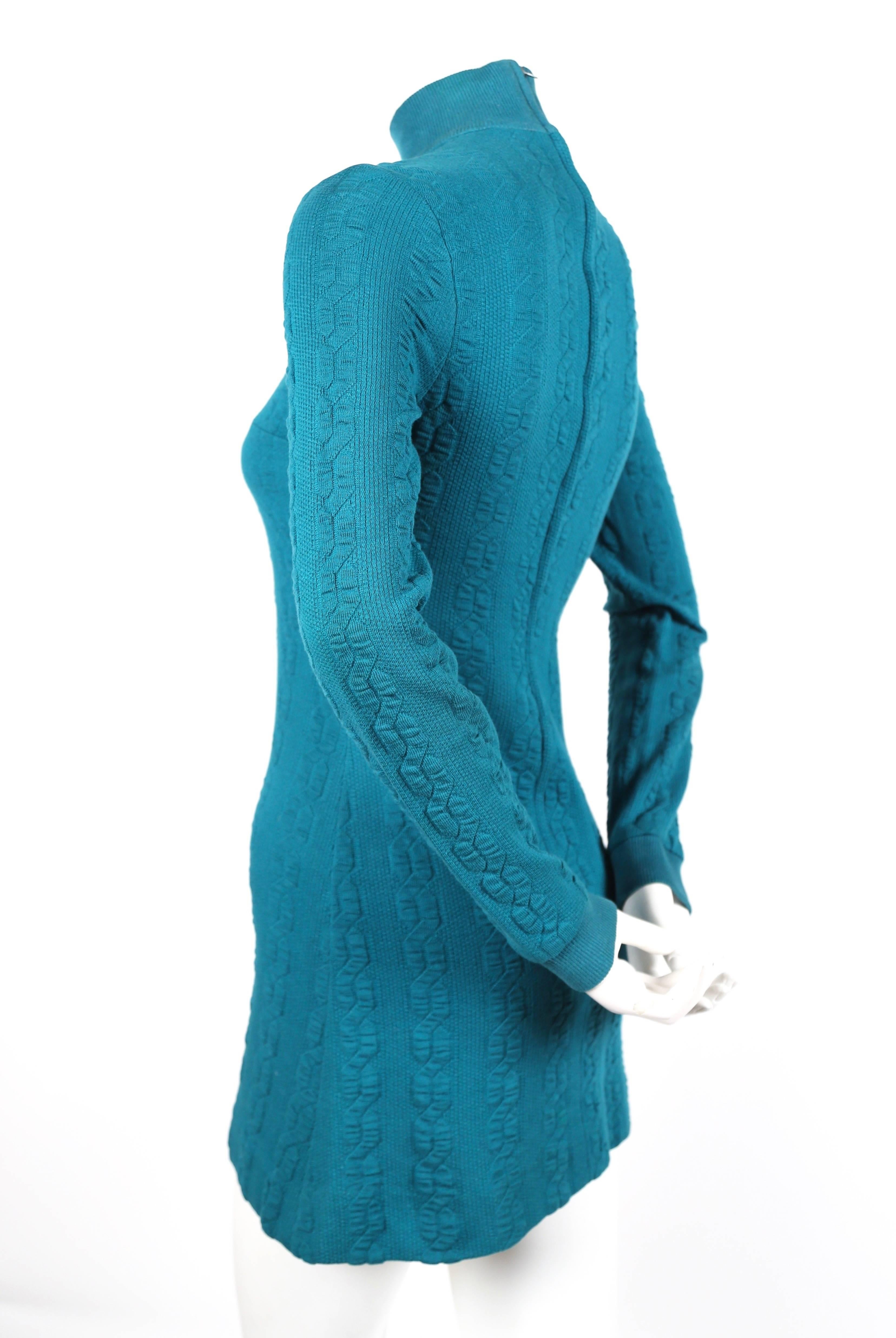 Turquoise cotton jersey mini dress designed by Betsey Johnson for Paraphernalia dating to the late 1960's. This dress is a very rare example of Betsey Johnson's earliest work as a designer. Dress is best suited for an extra-small or small.
