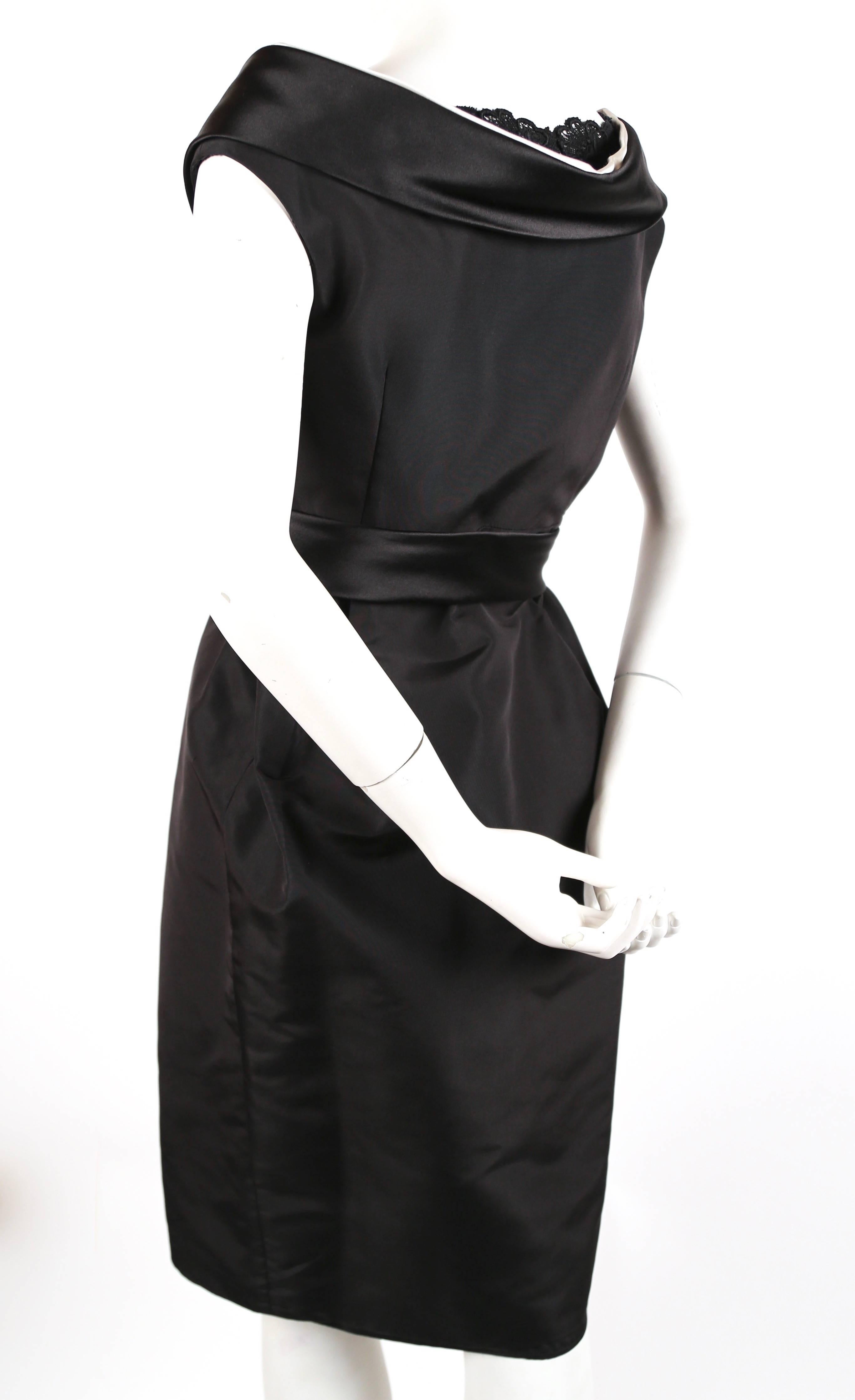 Jet black silk dress with 'raised' satin portrait collar and cotton Venetian lace neckline from Alexander McQueen dating to fall of 2006. Similar version was seen on the runway. Labeled an Italian size 44 which best fits a petite US 6-8. Approximate