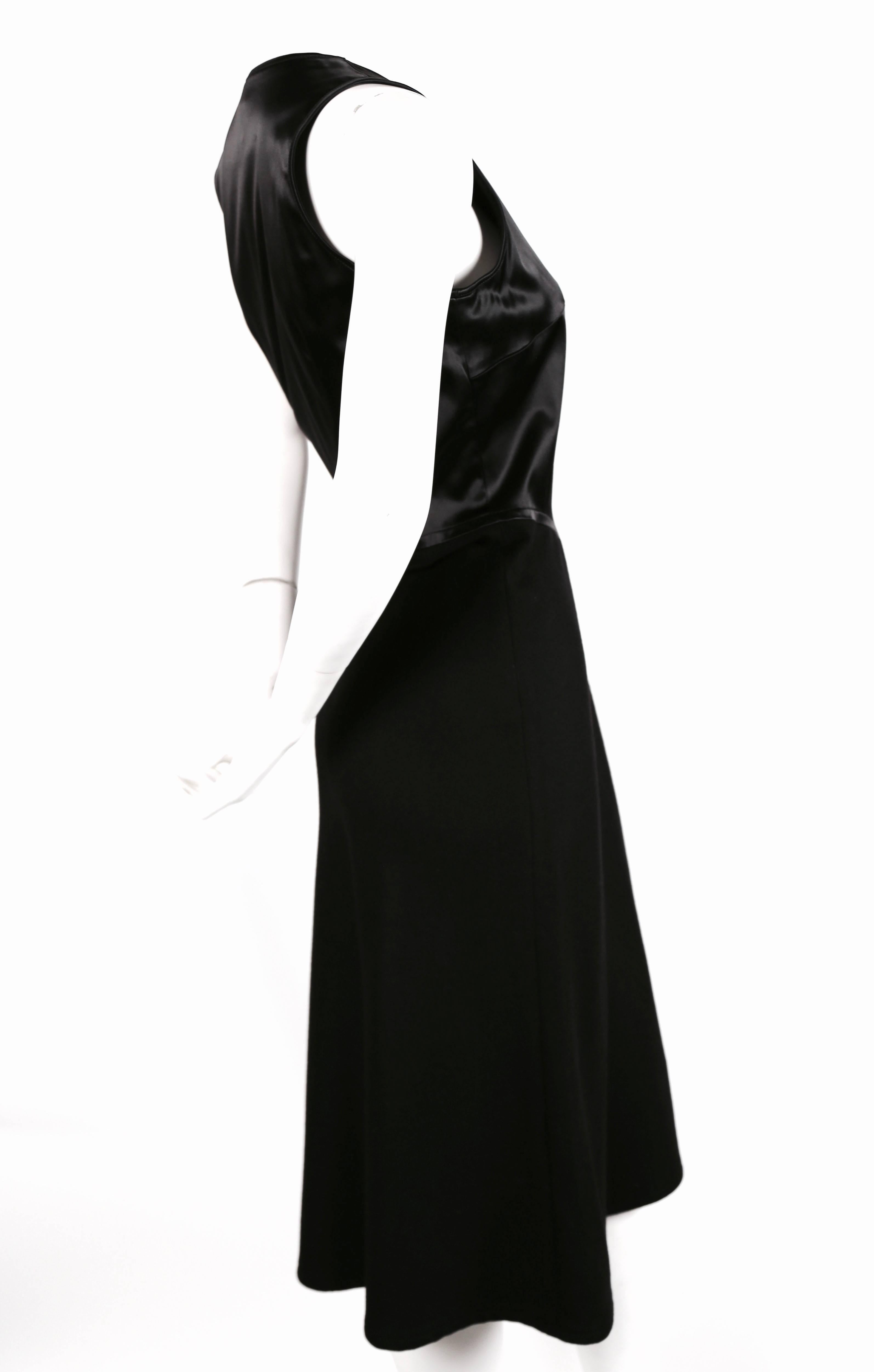 Jet black satin and angora dress with asymmetrical slit designed by Herve Leger dating to the 1990's. Best fits a US 6-8. Approximate measurements: 
36