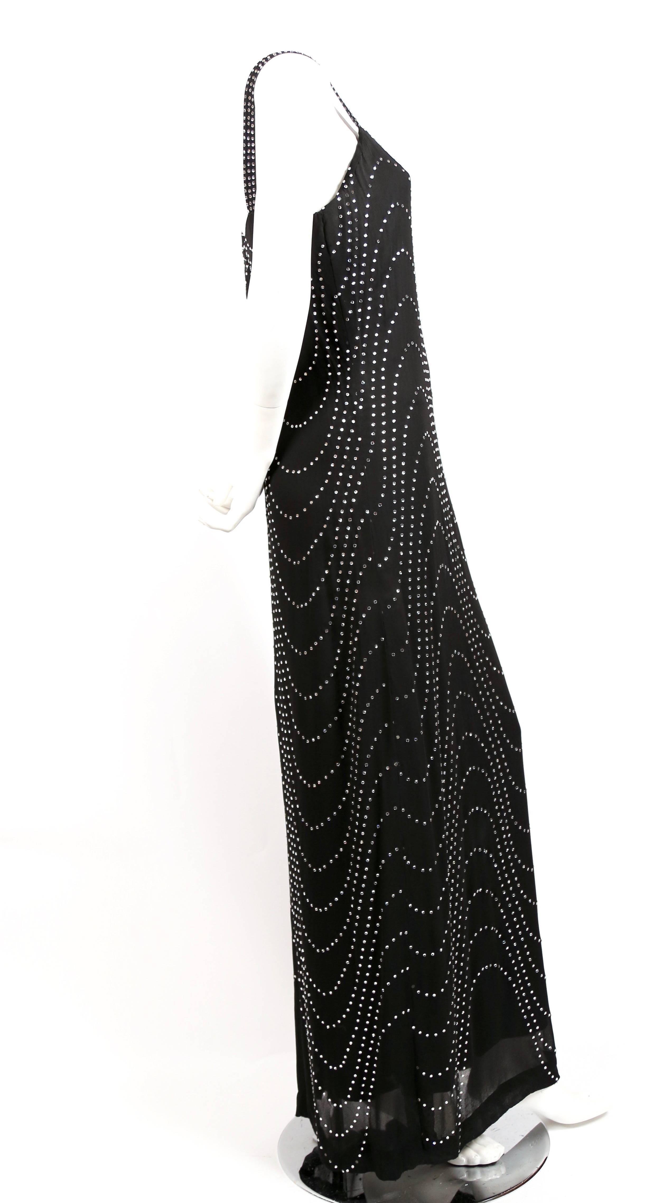Very rare black silk chiffon floor length haute couture gown with artfully arranged crystals from Pierre Balmain dating to the 1960's. Fits a US size 4 to 6. Approximate measurements: bust 33