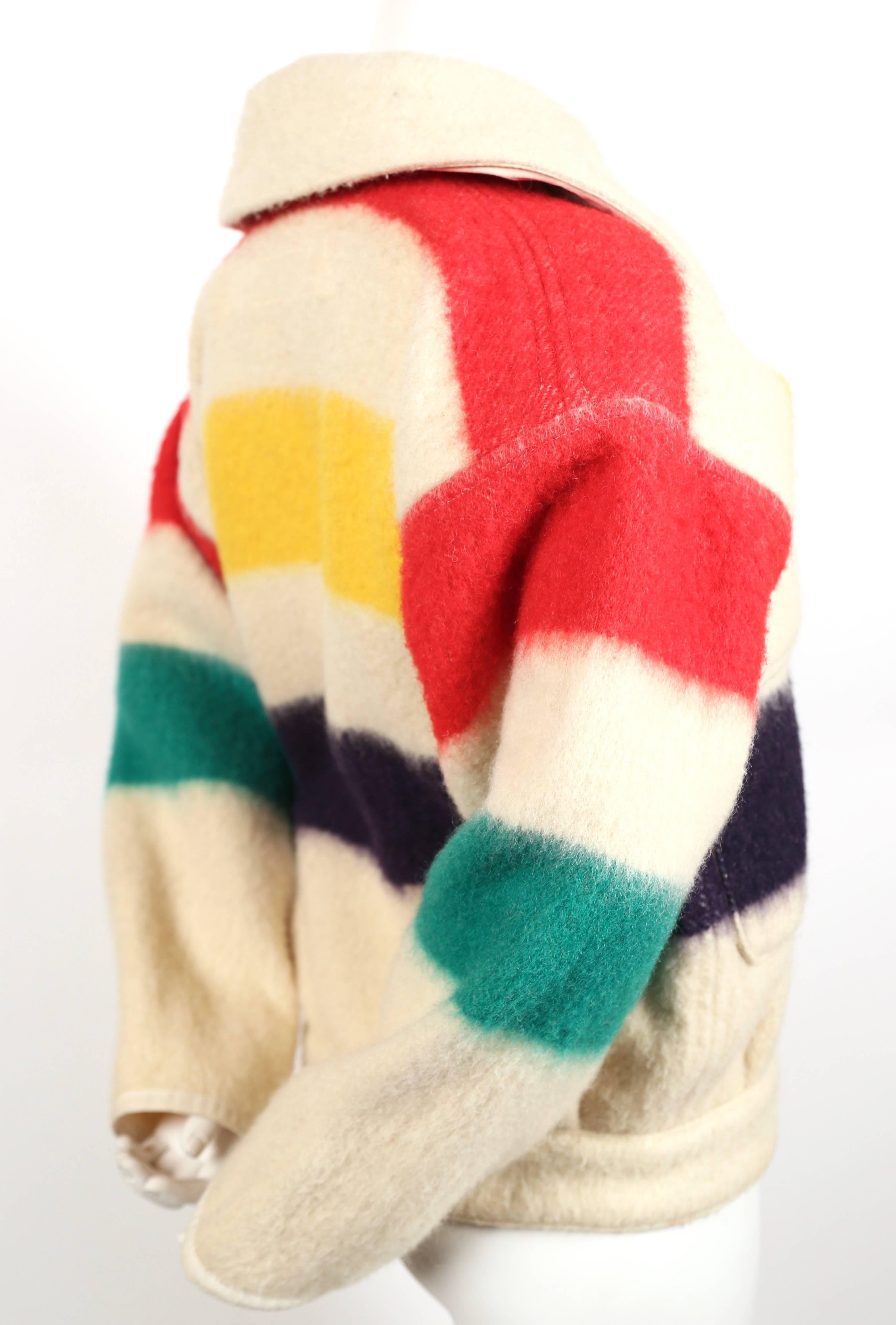  'Hudson bay' wool blanket jacket from Jean-Charles de Castelbajac dating to the late 1970's. Large dramatic collar. Patch pockets at front chest. Coat can be worn by a woman or small man. Best fits a US women's size 2-6. Approximate measurements: