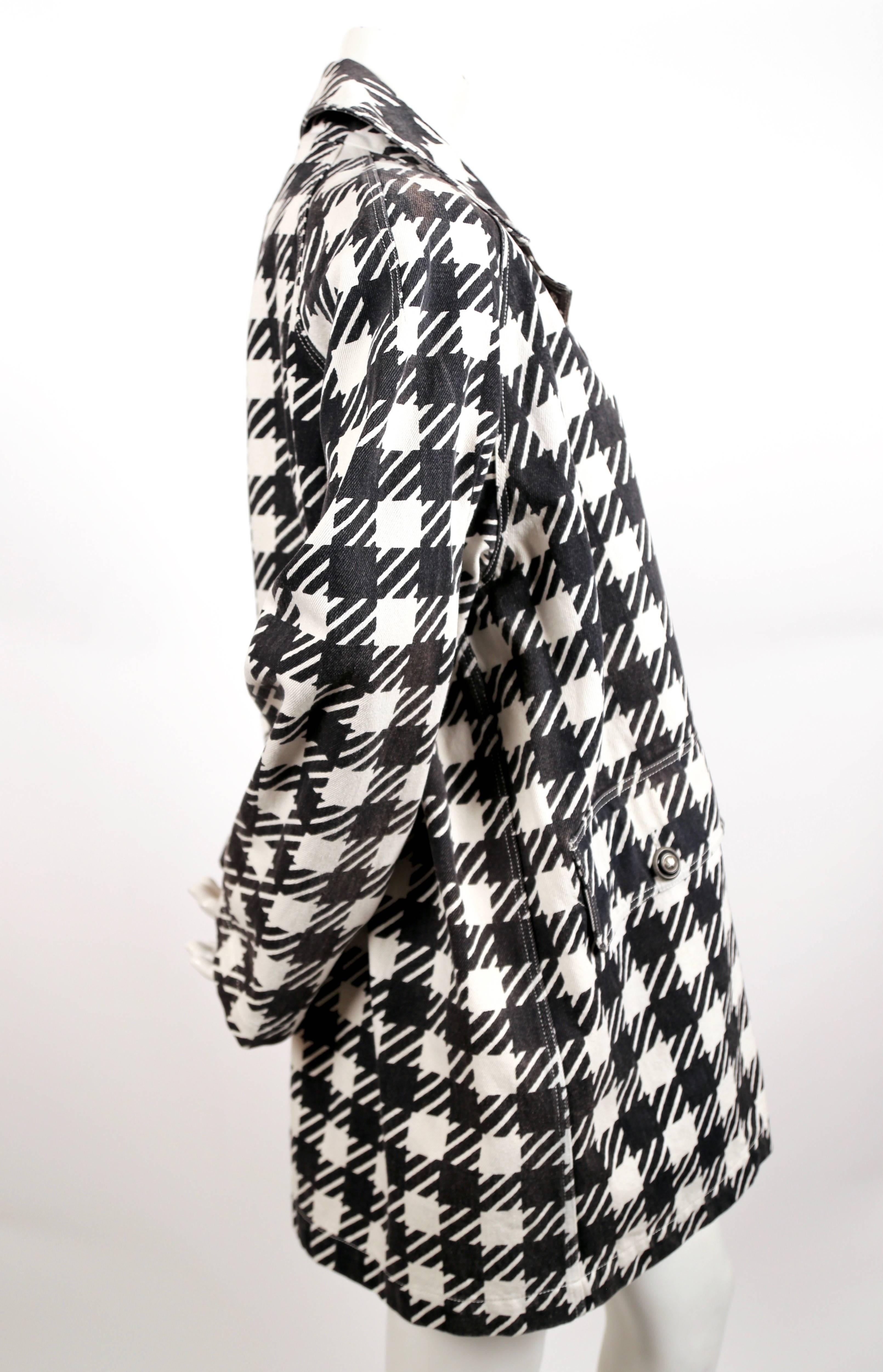 Black and white checked canvas coat designed by Azzedine Alaia for his ''Tati' inspired collection, spring of 1991 exactly as seen on the runway. Labeled a French size 40 however this has an oversized cut so it fits many sizes. Approximate