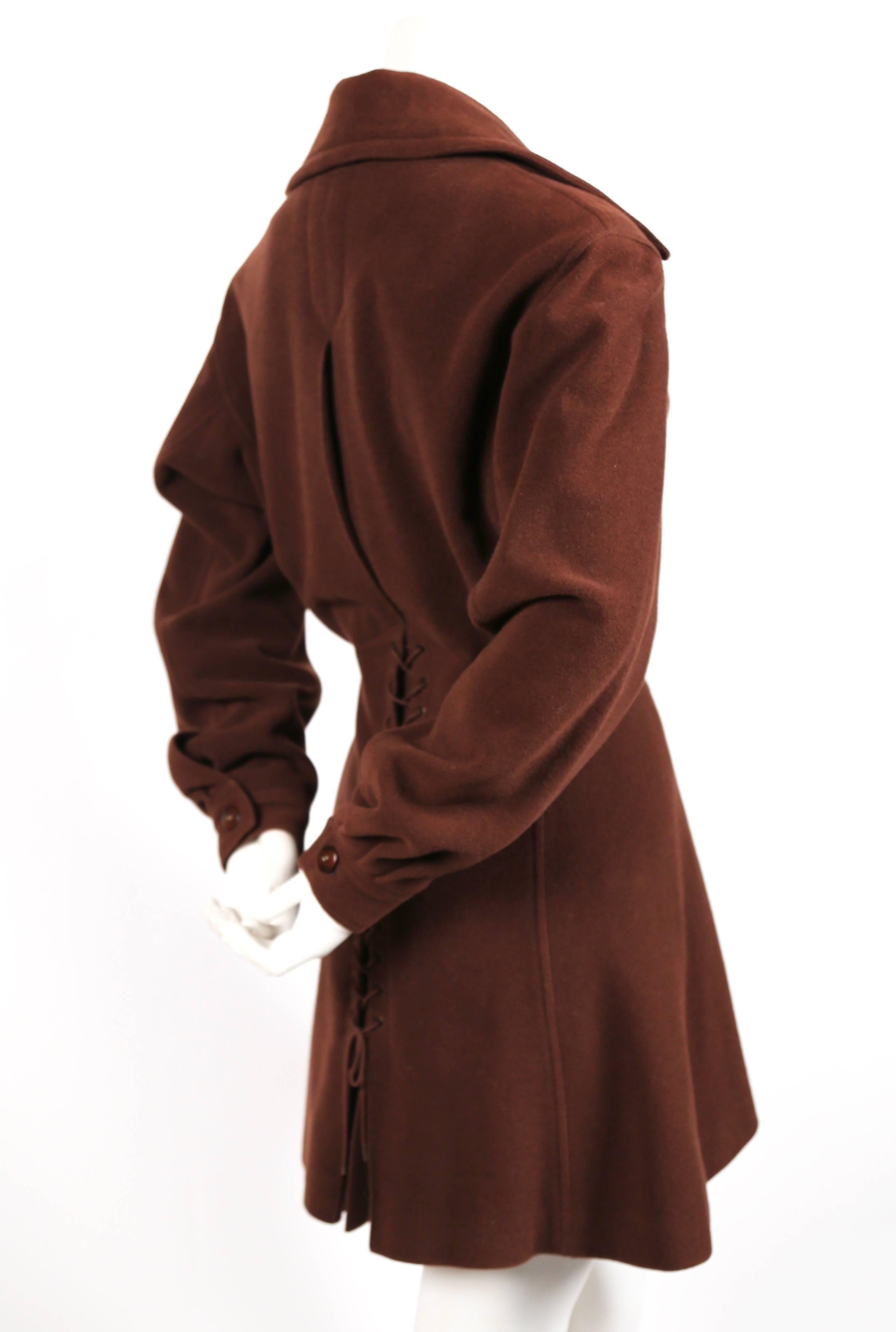 Brown wool coat with dramatic corset lace-up back from Azzedine Alaia dating to the 1980's. Best fits a US 6-10. Approximate measurements: shoulder 19