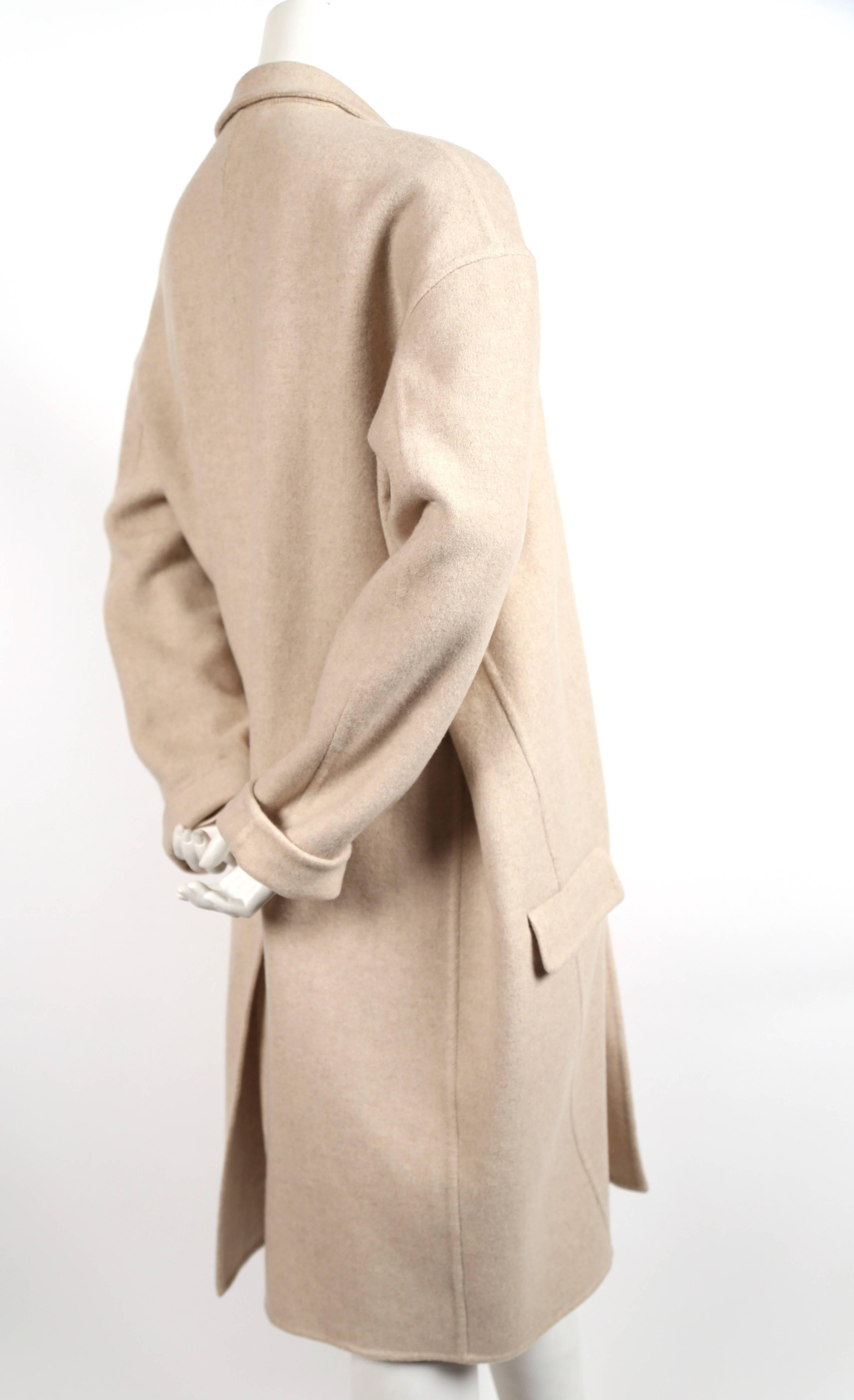 Very soft, heathered-oatmeal colored cashmere coat in an 'egg shape' designed by Phoebe Philo for Celine. French size 40. Approximate measurements: drop shoulder 22