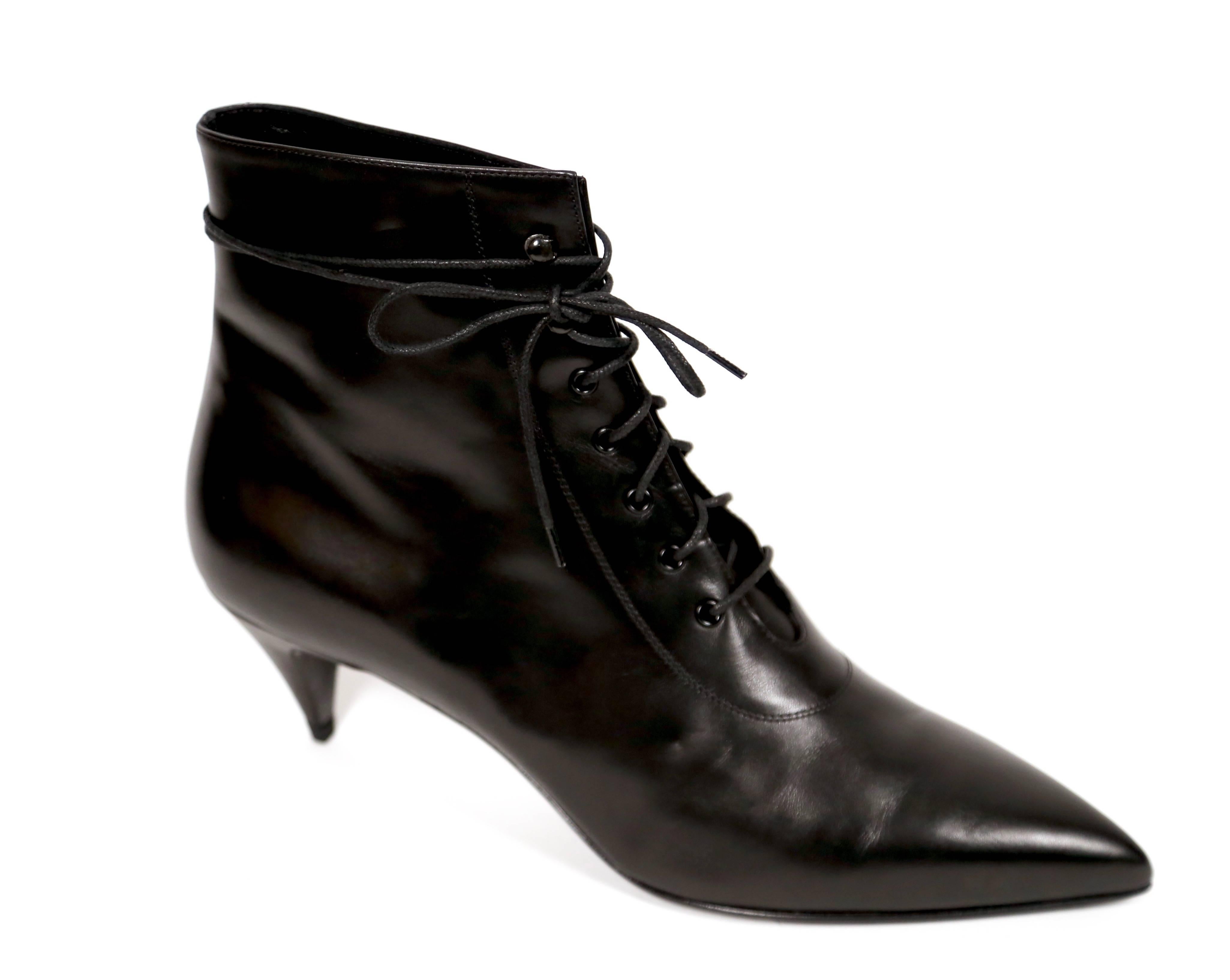 Jet black leather 'Cat 50' lace up boots designed by Saint Laurent. Size 41. 2