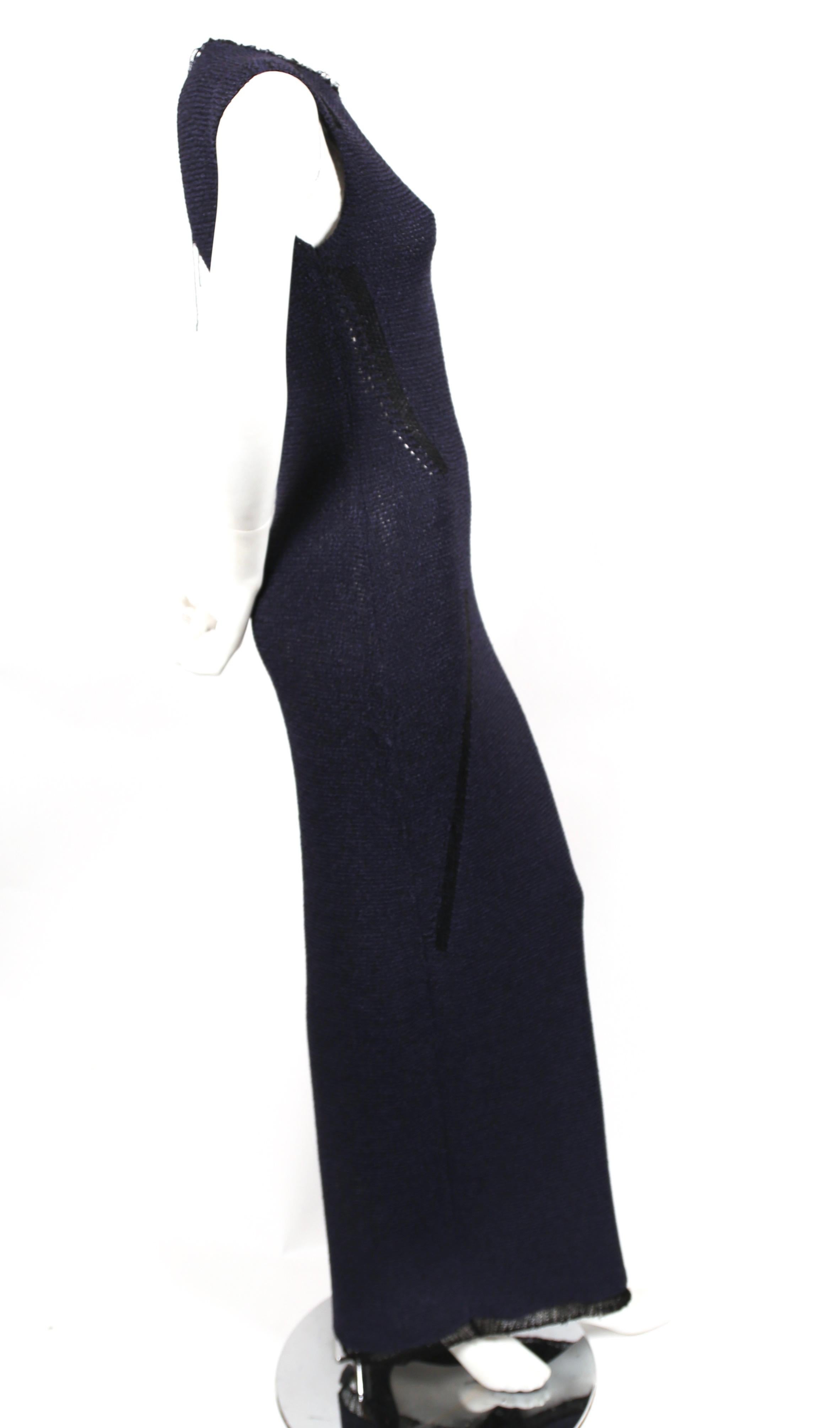 Navy blue and black knit dress with raw collar and delicate woven hem designed by Phoebe Philo for Celine. No size is indicated however this is an XS.  Approximate measurements: shoulder 13