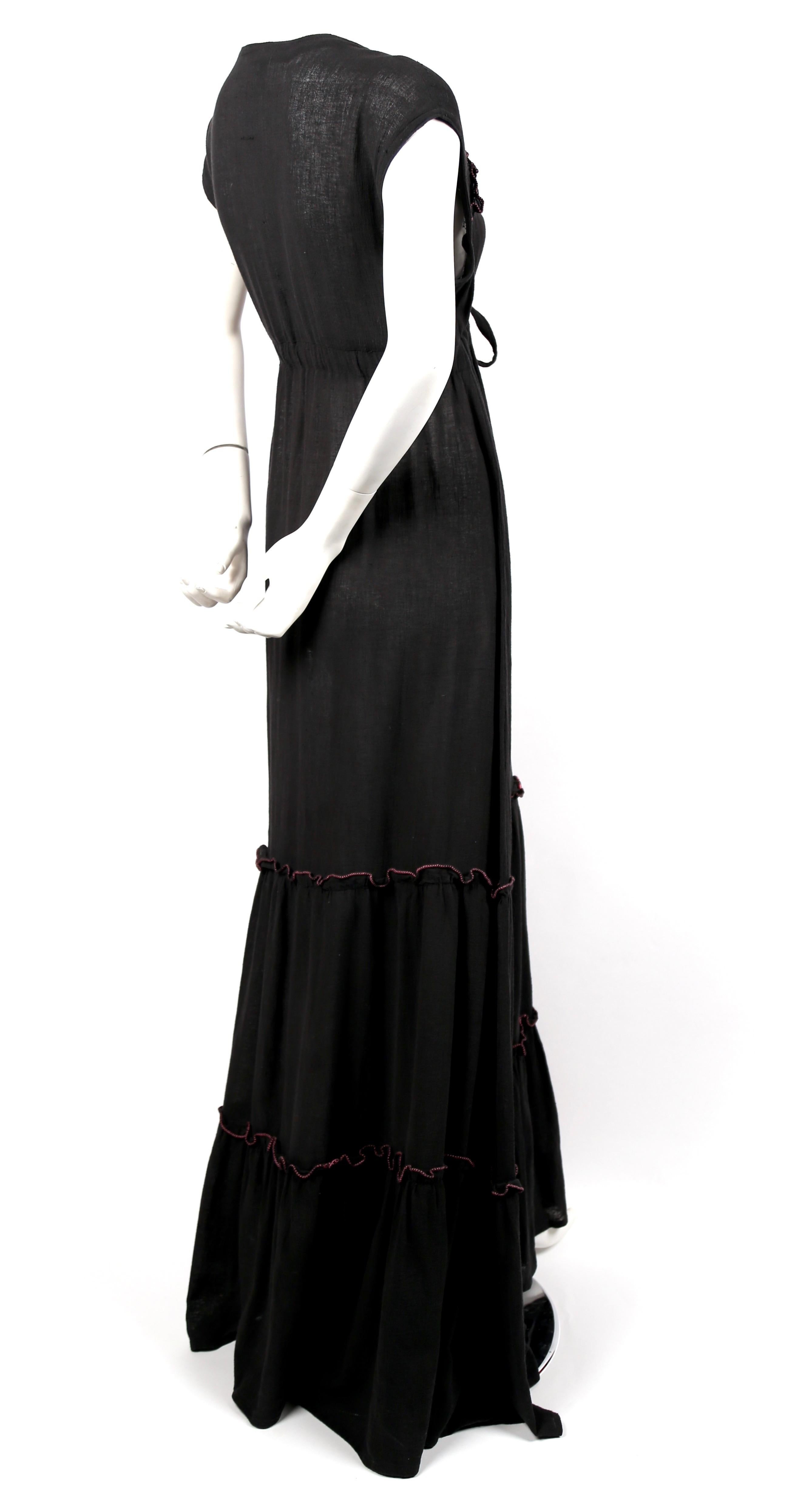Soft-black, cotton gauze maxi dress with pink stitching made by Radley dating to the 1970's. UK size 12. Dress was photographed on a size 2 mannequin and was not clipped. Adjustable empire waist drawstring closure. Approximate length 62