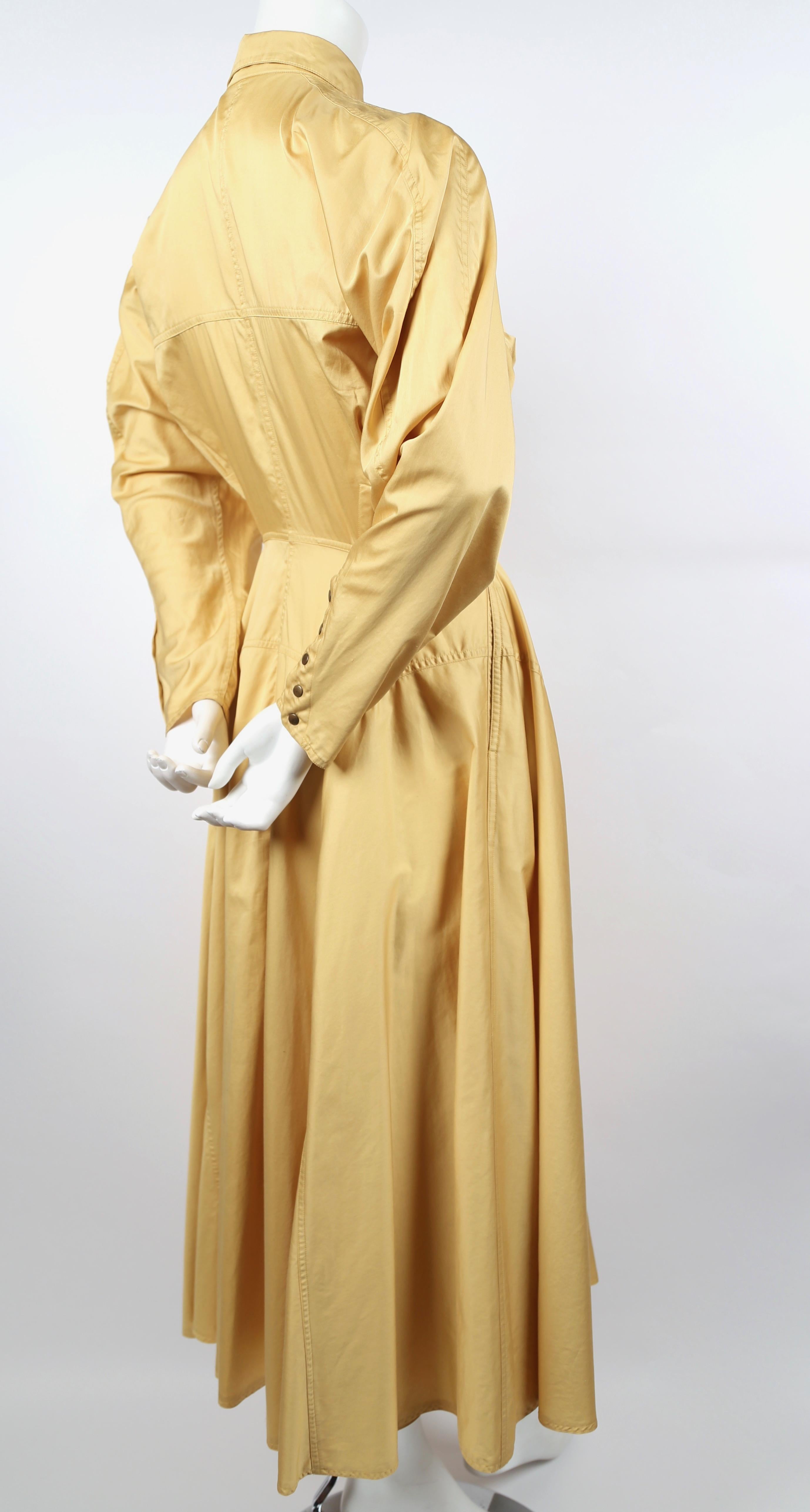 Very rare, light saffron colored cotton blend dress with fully seamed skirt and snap closure from Azzedine Alaia dating to the 1980's. Dress has a very flattering, unique shape. Labeled a French size 40 however this would best fit a French 38 or