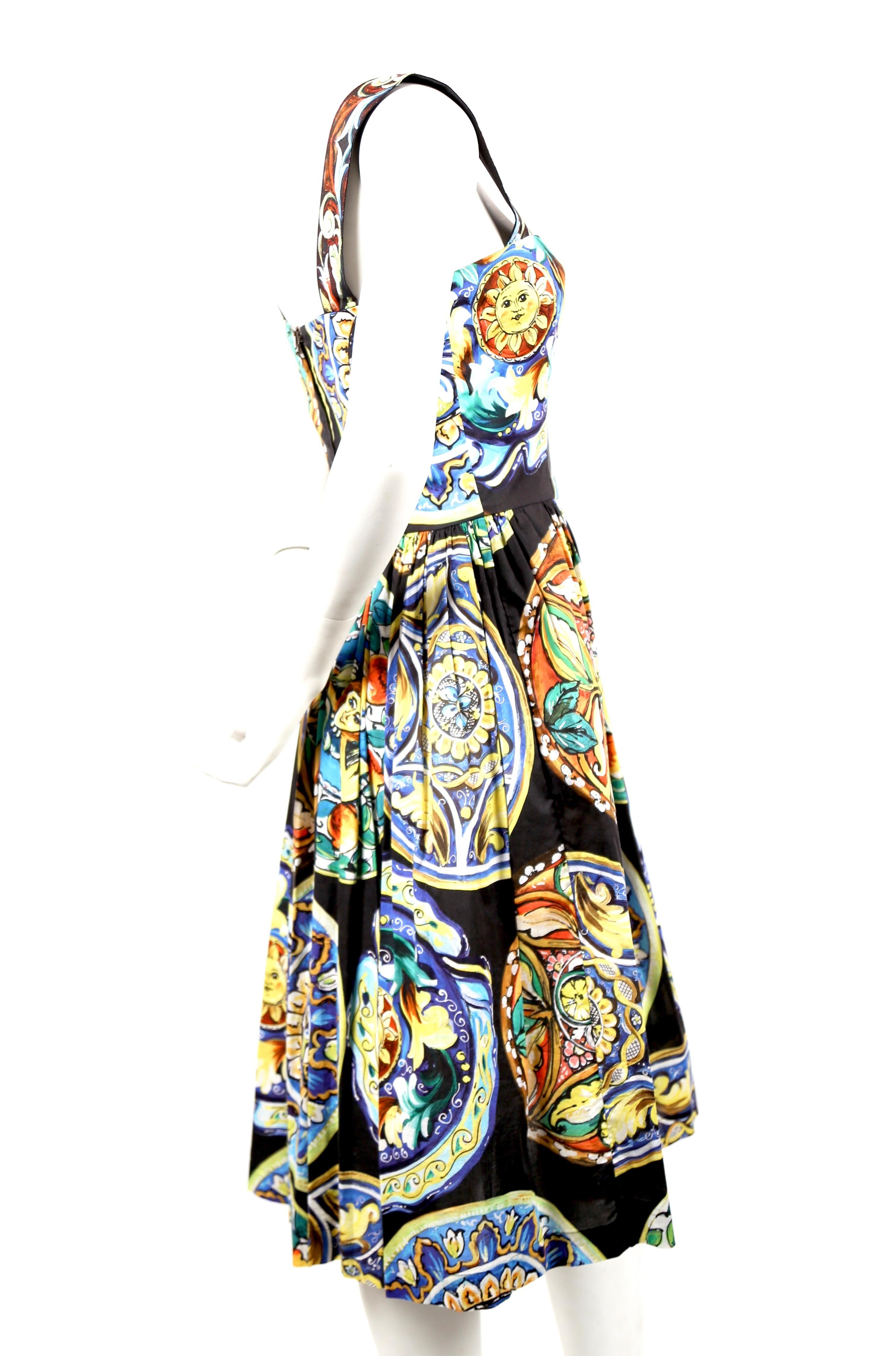 Floral printed cotton day dress designed by Dolce & Gabbana. Labeled an Italian size 42 however it best fits a US 2-4. Approximate measurements: 32