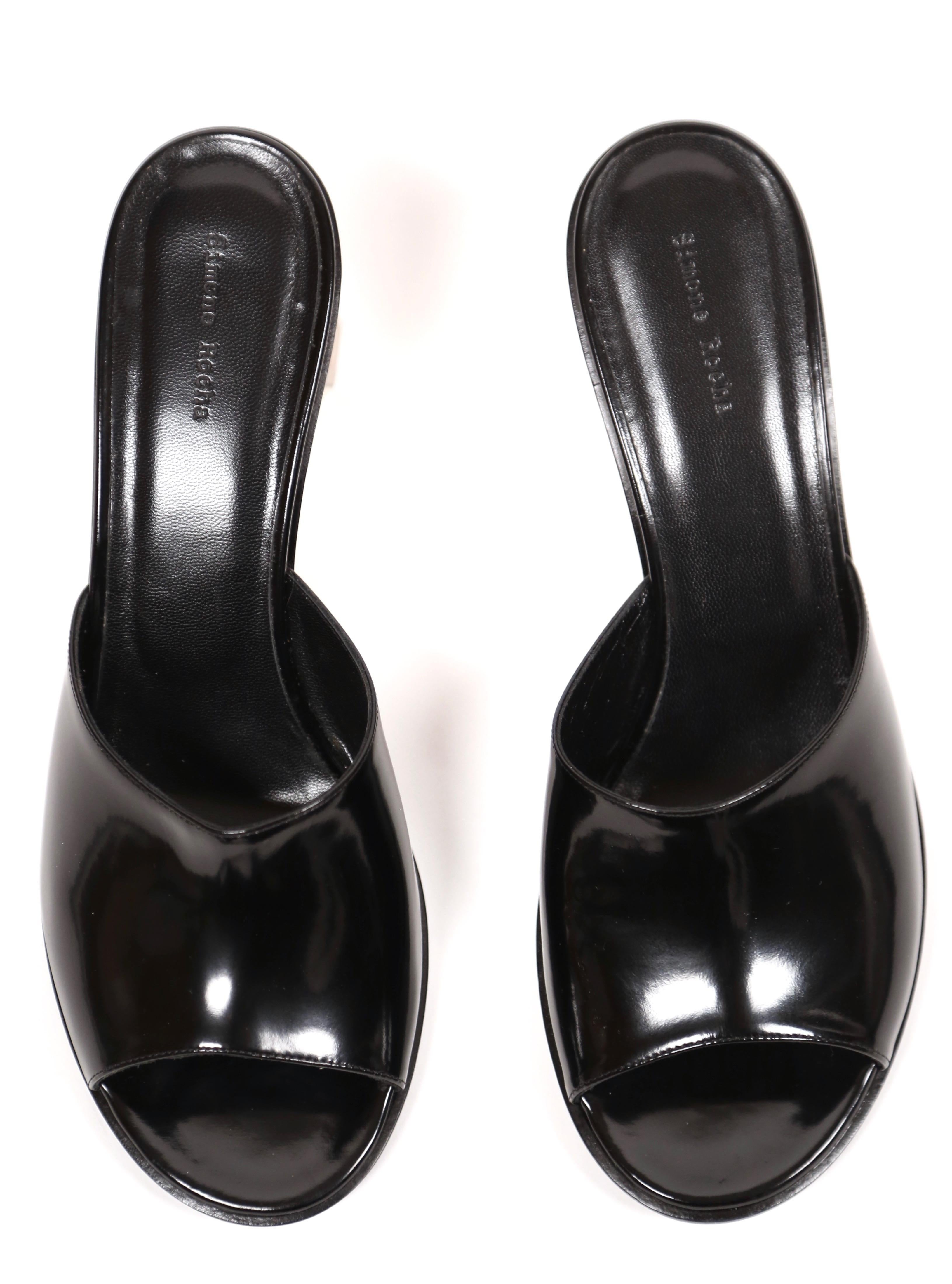 Jet- black patent slide sandals with faceted clear 'chandelier' heels designed by Simone Rocha. Euro size 41. Insoles measure approximately: 10.75