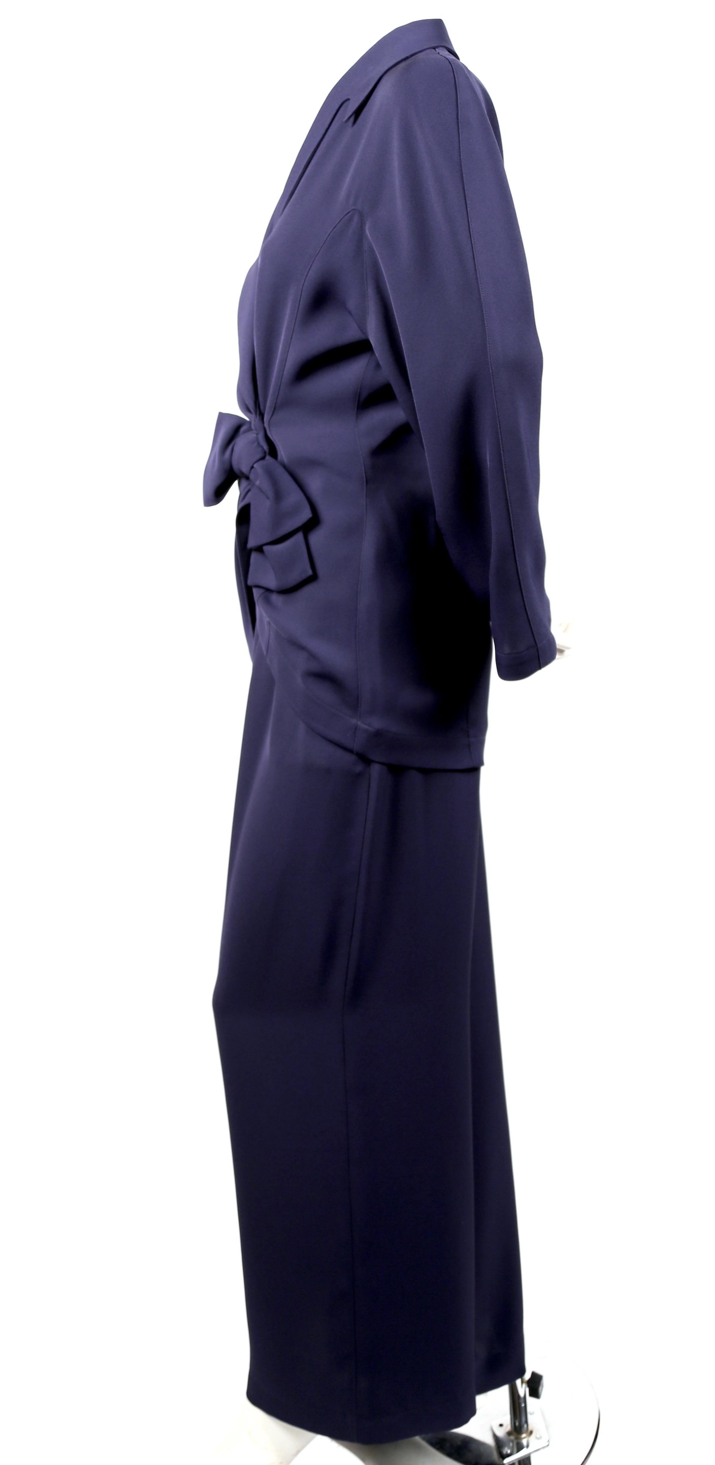 Navy blue suit with wrap jacket and wide leg pants designed by Thierry Mugler dating to the 1990's. French size 38. Approximate measurements for jacket: waist 28-29
