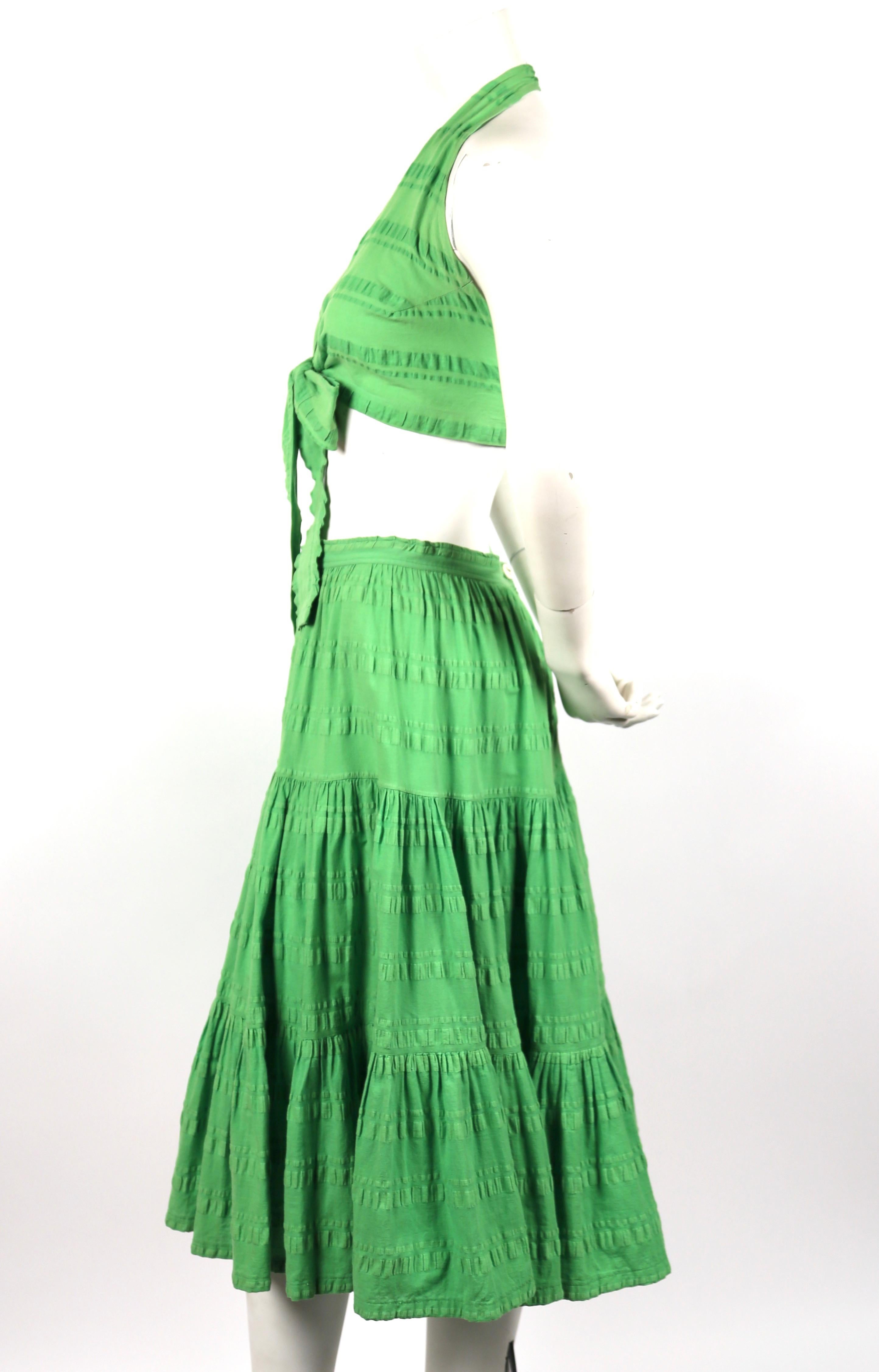 Matching crop top and tiered skirt in lime seersucker cotton designed by Yves Saint Laurent dating to the 1970's. Top is labeled a size 2 and skirt is a 38 although both pieces have been altered. Top is adjustable and skirt measures approximately: