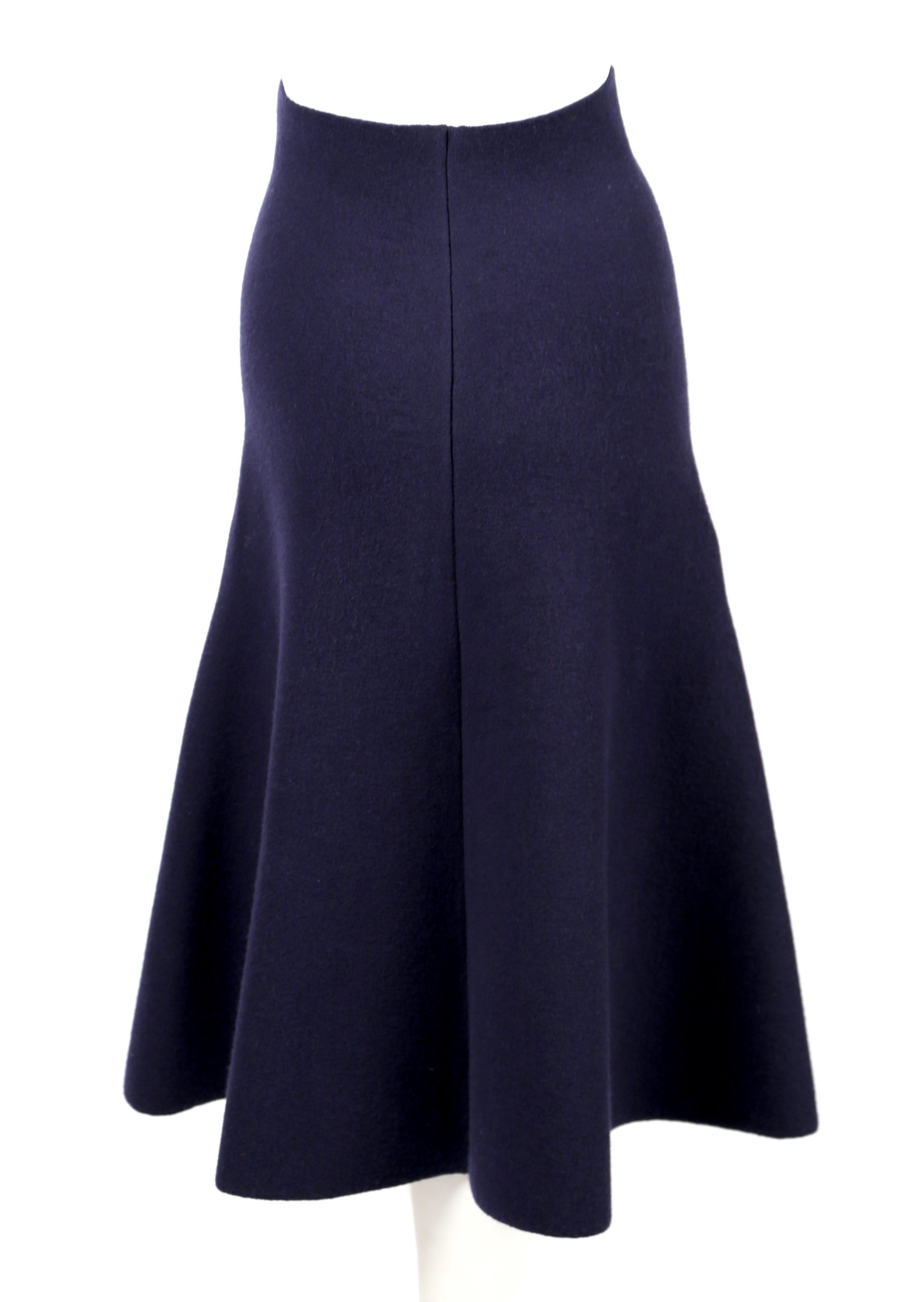 Deep navy-blue, flared knit skirt designed by Phoebe Philo for Celine exactly as seen on the runway for fall of 2013. Very flattering and comfortable fit. Labeled a French size XS. Approximate measurements (unstretched) : 26