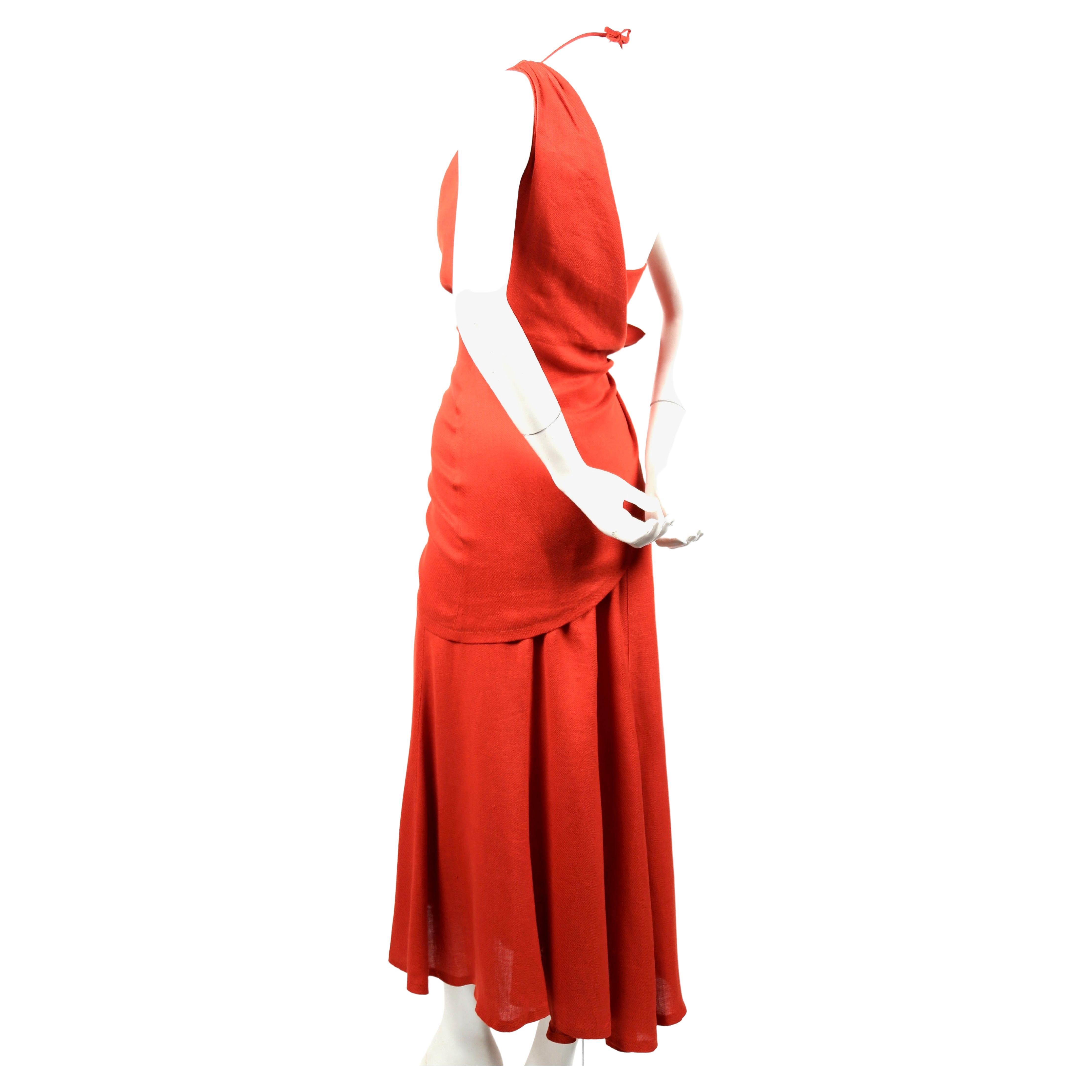 Terracotta linen dress with asymmetrical wrap designed by Thierry Mugler dating to the 1990's. French size 36. Approximate measurements: bust 32-33