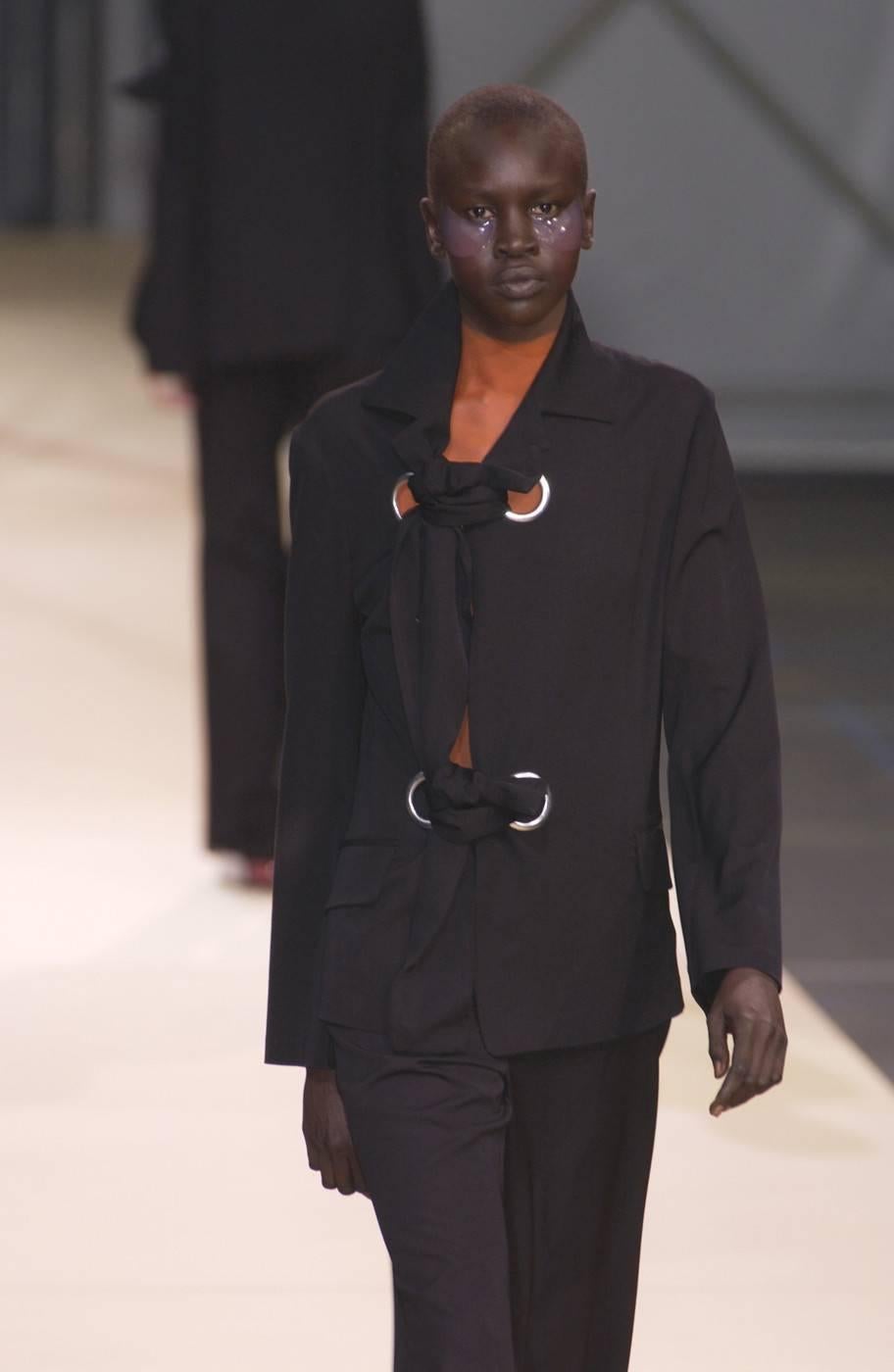 Black 2004 YOHJI YAMAMOTO black runway jacket with large silver grommets
