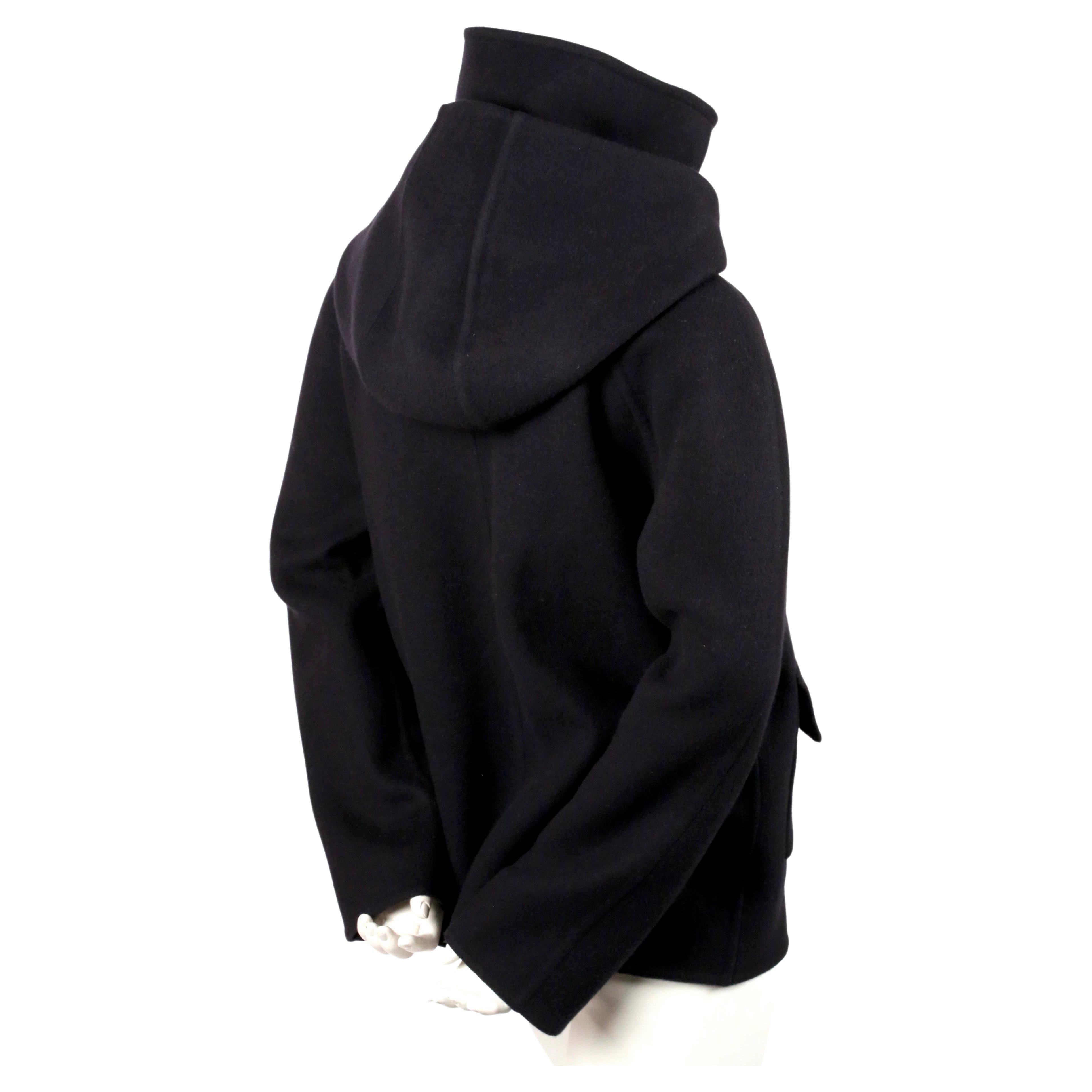 Darkest navy, double-faced cashmere jacket with hood and patch pockets designed by Phoebe Philo for Celine as seen in the pre-fall collection of 2014. French size 38. Approximate measurements: bust 40