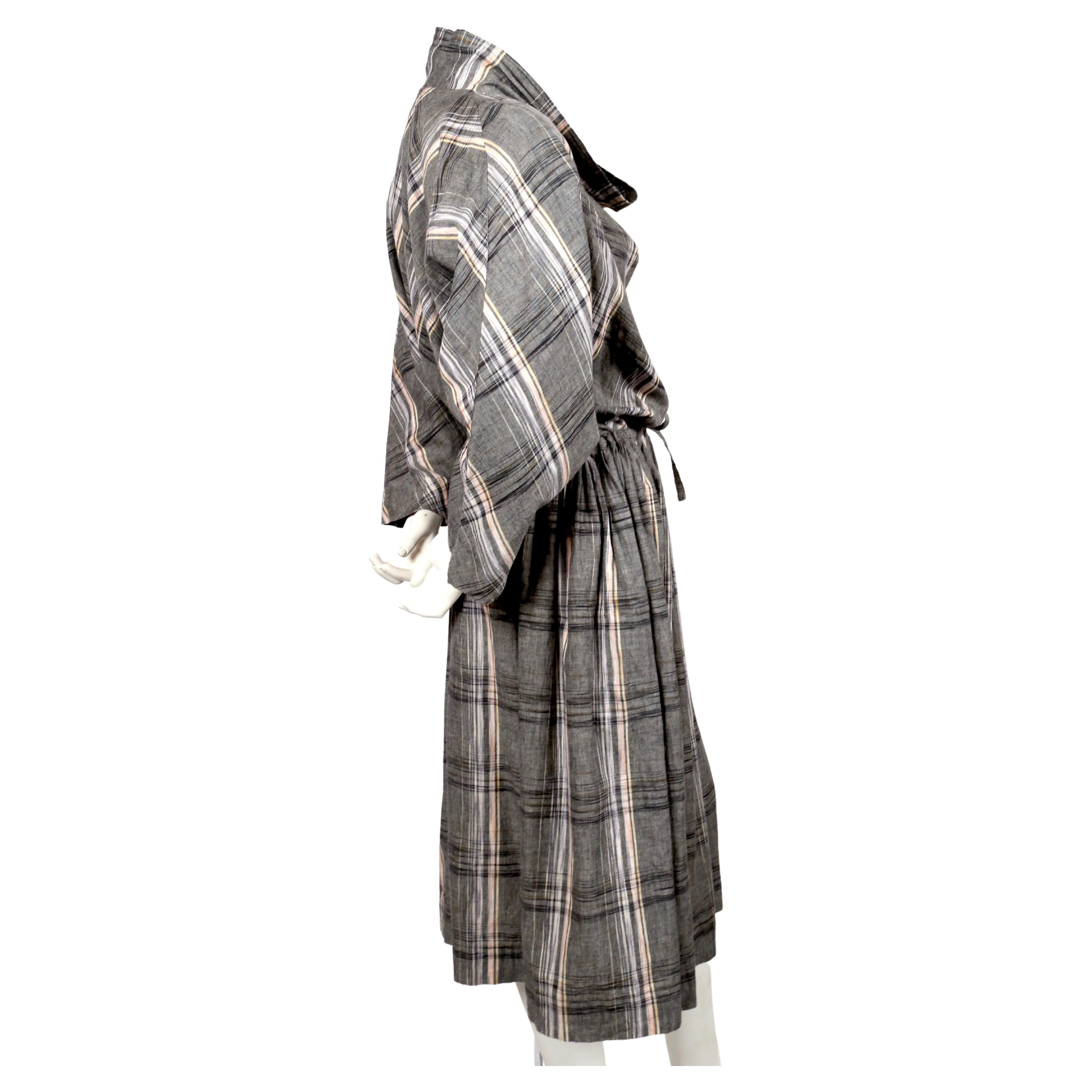 Plaid linen blend dress with cowl neckline, drop waist with drawstring and three quarter length sleeves designed by Issey Miyake dating to the early 1980's. Japanese size M, however this fits many sizes due to the oversized cut. Approximate length: