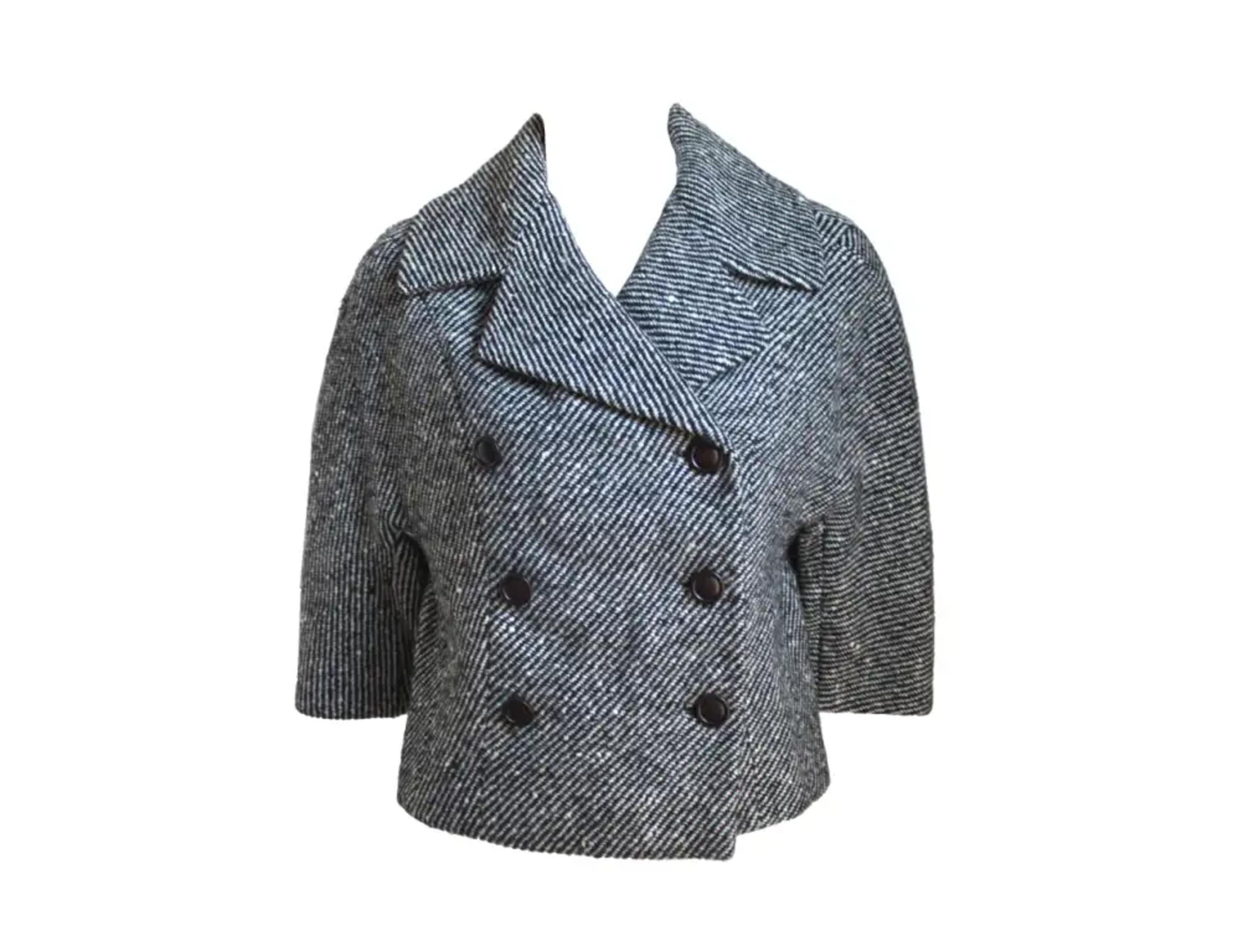 Black tweed double breasted wool jacket from Jacques Heim for Harrods dating to the 1950's. Jacket fits a size small or medium.  Approximate measurements are as follows: bust 38
