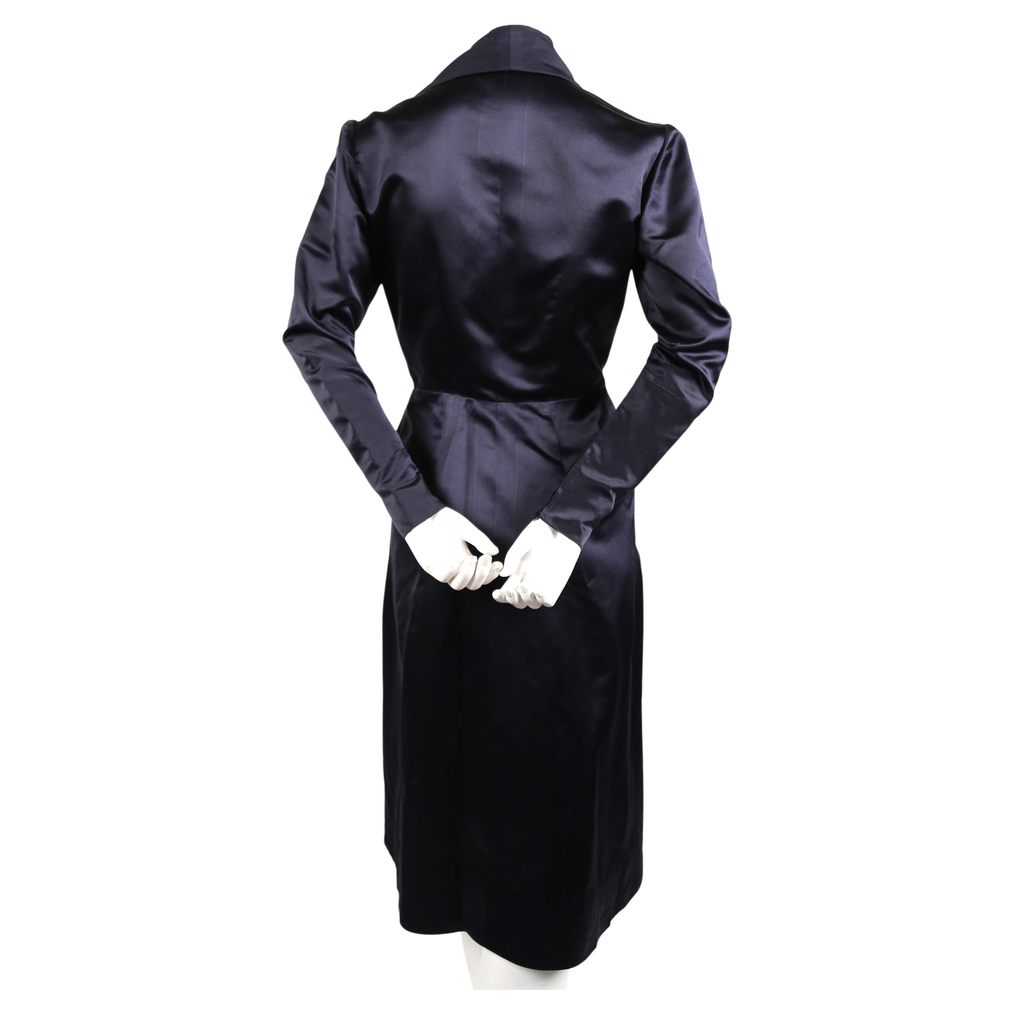 Very rare navy satin coat dress designed by Jacques Fath for Joseph Halpert dating to the 1940's. Best fits a size 4. Approximate measurements: shoulders 15