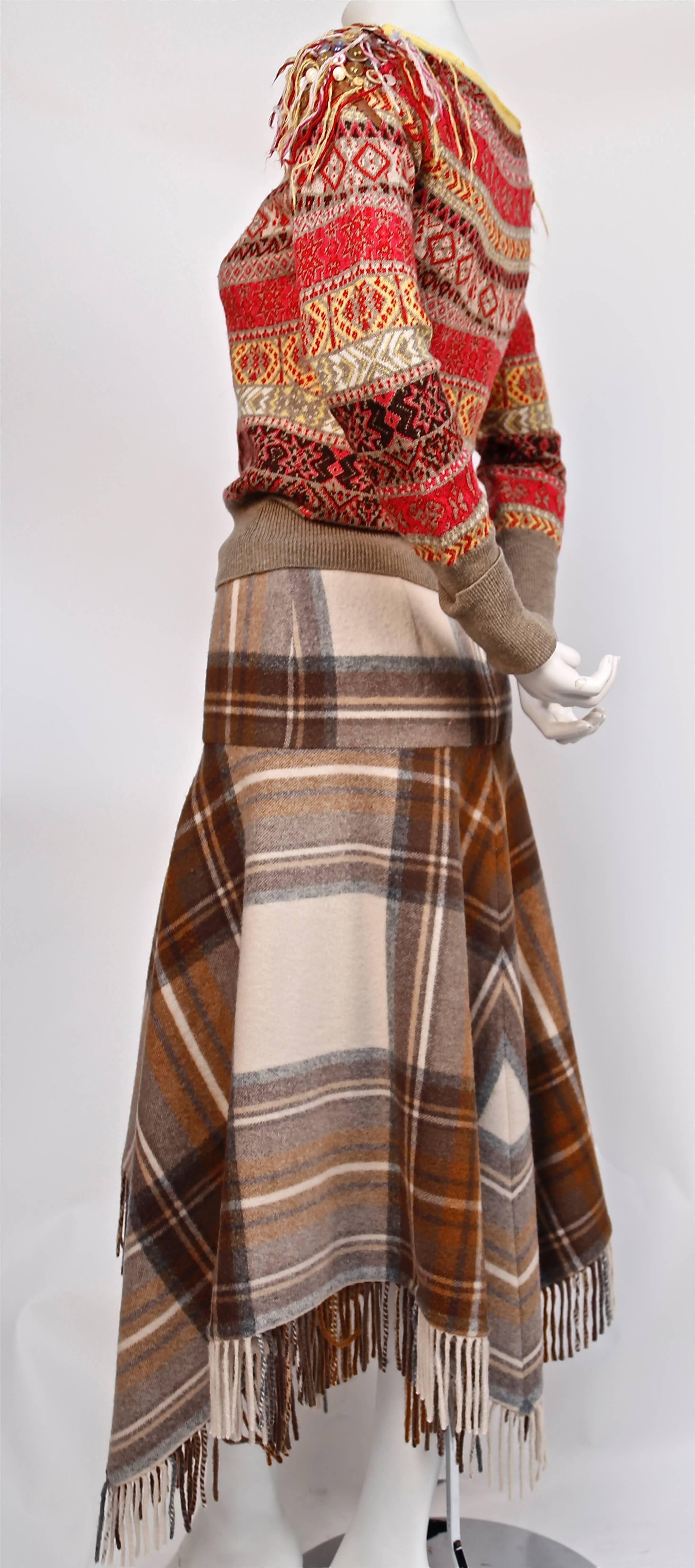 Very rare wool fair isle sweater with leather trim and tartan fringed skirt from Alexander McQueen dating to fall of 2005 exactly as seen on the runway. Sweater is a size 'S' and skirt is an Italian size 40. Fits a US 4. Made in Italy. Excellent