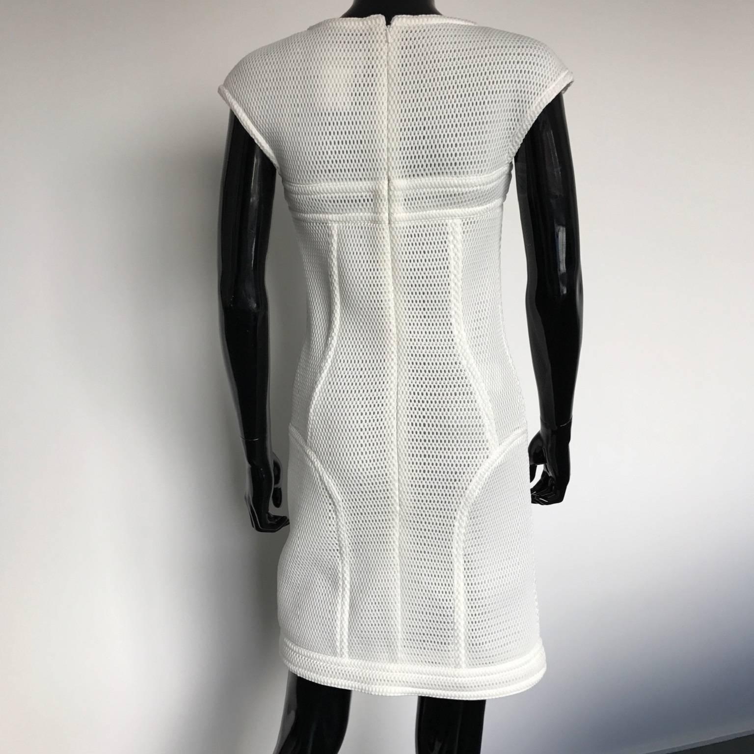 This Chanel cocktail dress was designed by Karl Lagerfeld.
Circa 2012 in white fantasy mesh.
100% polyamide - nylon
Lining 100% silk for a perfect fitting
This vintage article is in perfect condition