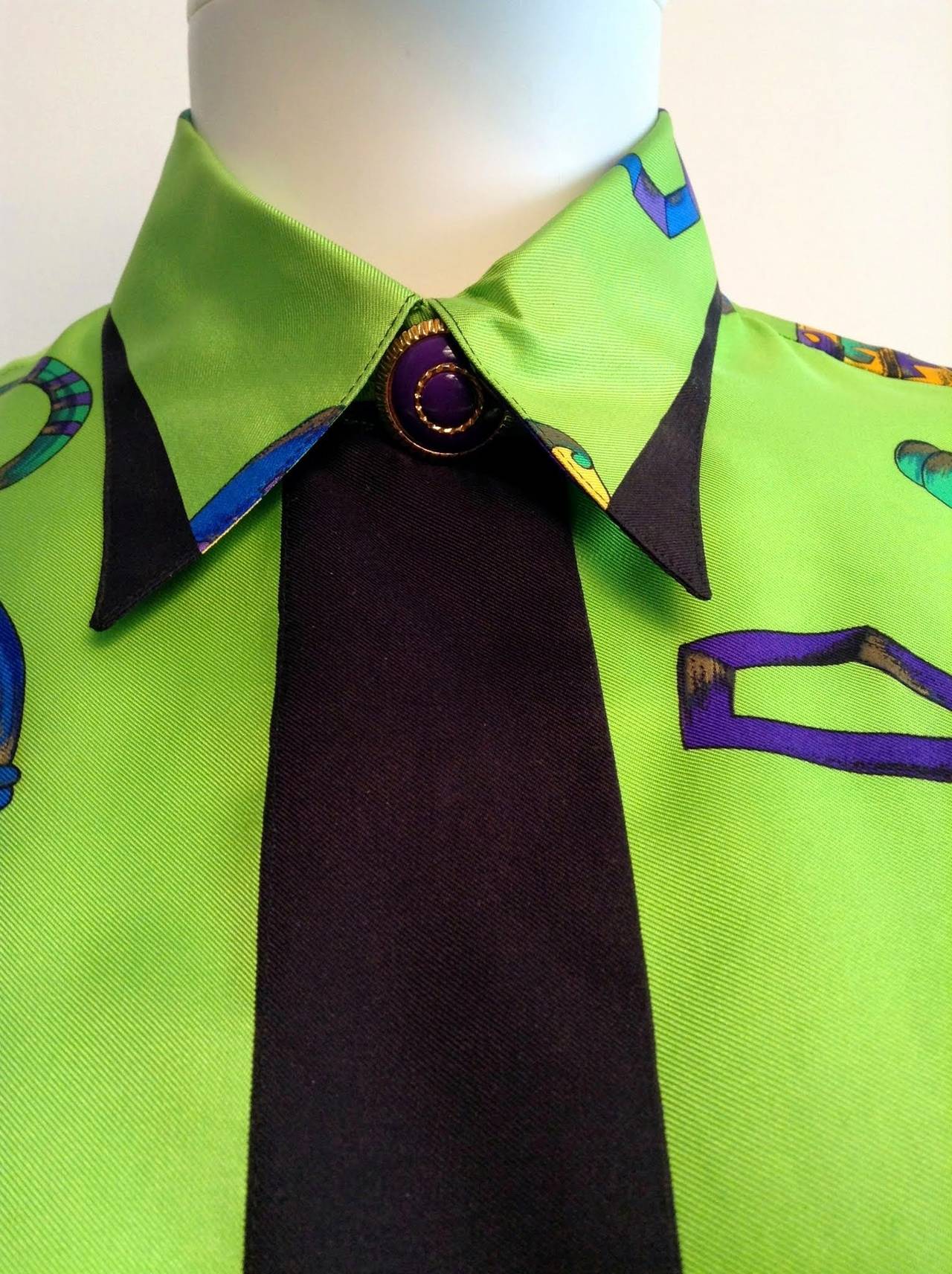 A stunning, rare piece from Gianni Versace. Circa 1994, vintage. 

Cuff snaps and button have been moved as shown in photos. 

100% silk

Measurements:

Length 26