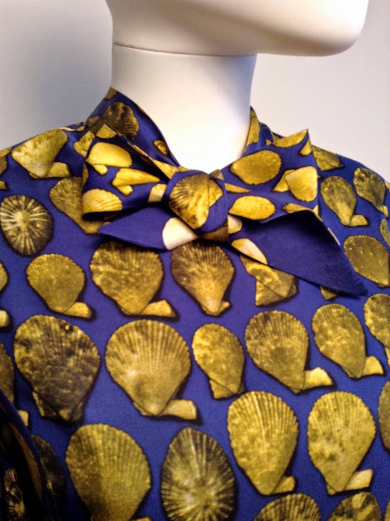 Late 60's stunning vintage Hermes silk 'coquilles' print blouse, with neck tie. The blouse is beautifully tailored, buttoning up the by using six silk-covered buttons and featuring classy details such as hand-sewn interior seams. Would be a great