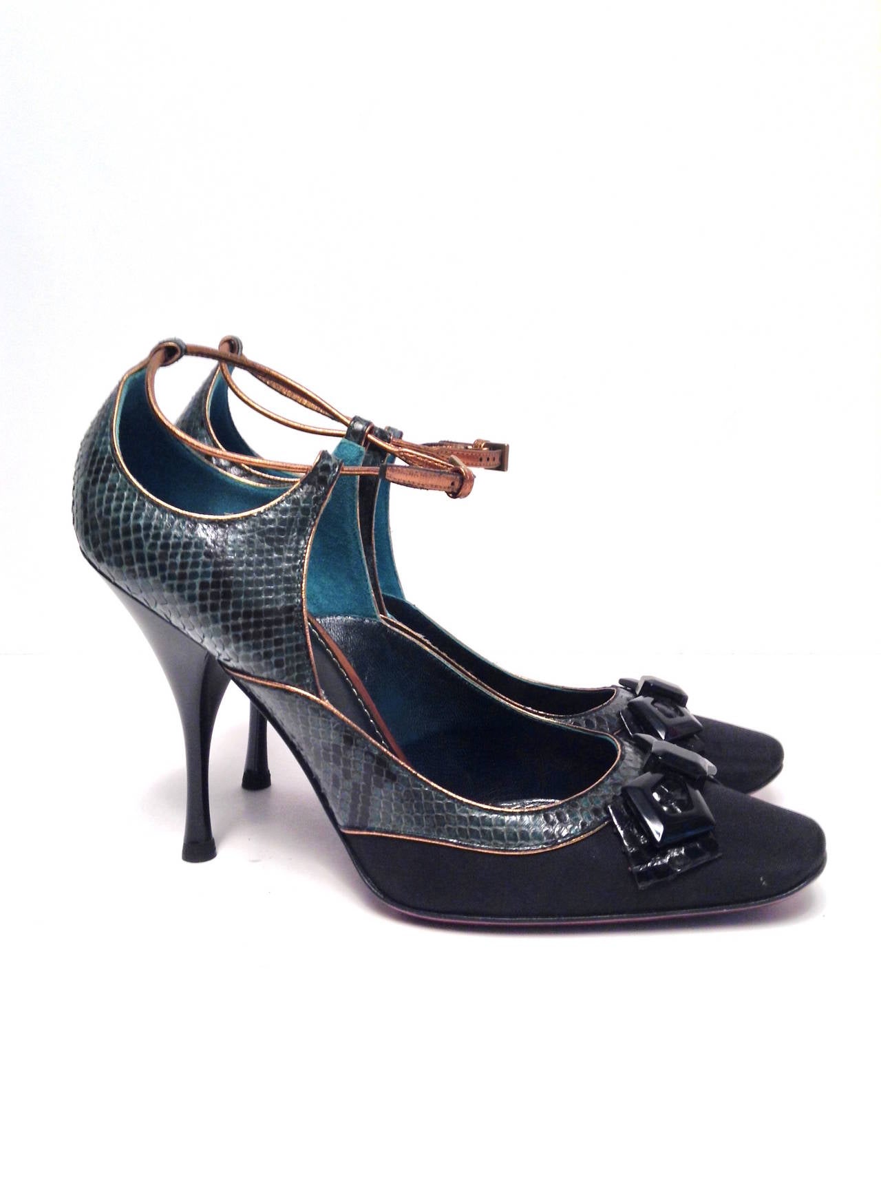 Stunning green python, black silk, and gold leather piping adorn this spectacular shoe.

3.5