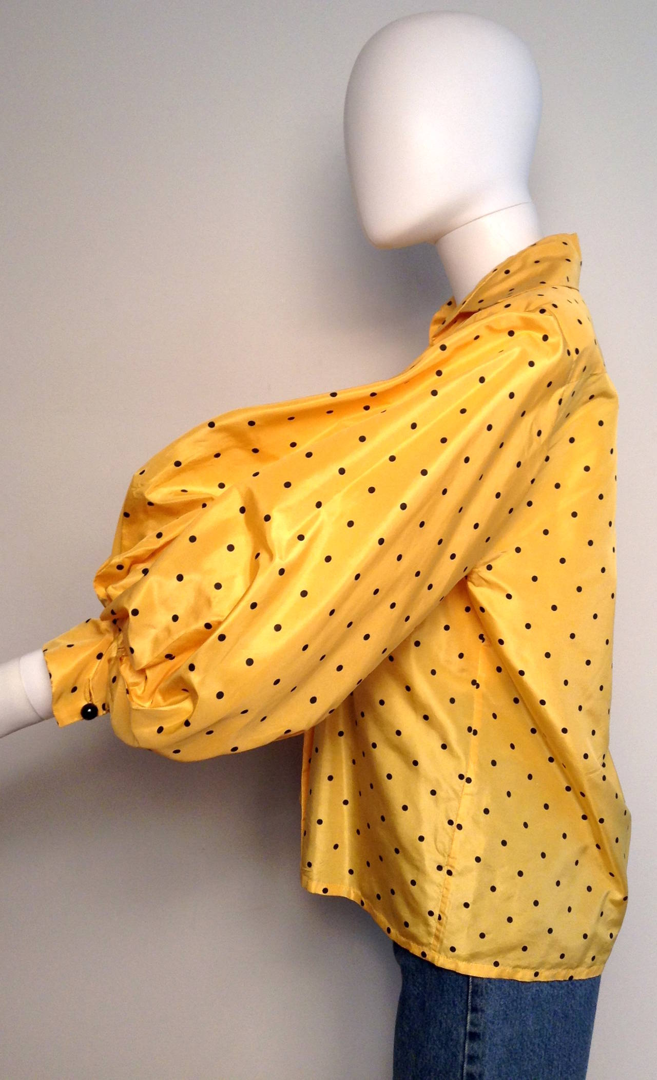 Super fun Yellow and Black Polka Dot Blouse by none other than Christian Dior. Features three quarter sleeves, and button up closure. 

Measurements: 43