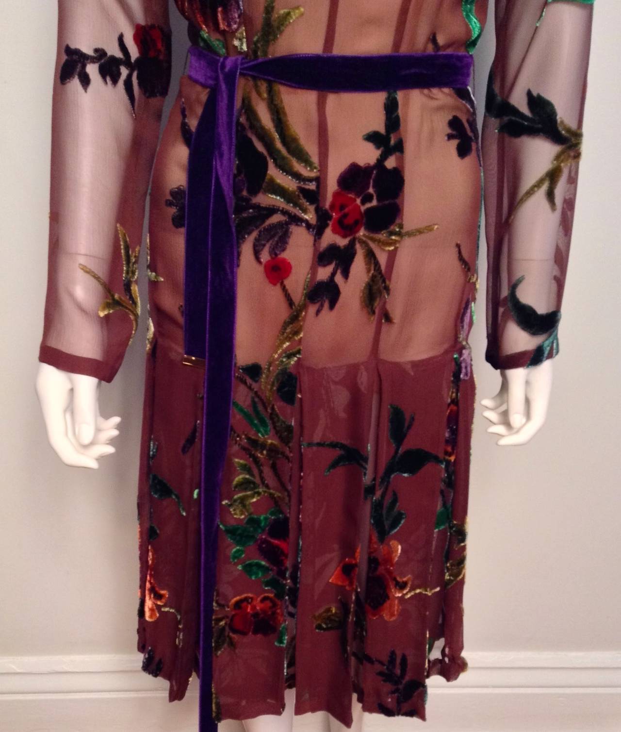 Beautiful long-sleeved silk brown dress with floral velvet and a pleated skirt. Still with tags, this dress retailed for $12,250 originally. 

As seen on Anna Wintour in 2012 when she hosted a fundraiser for Obama in London. 
Rare and very