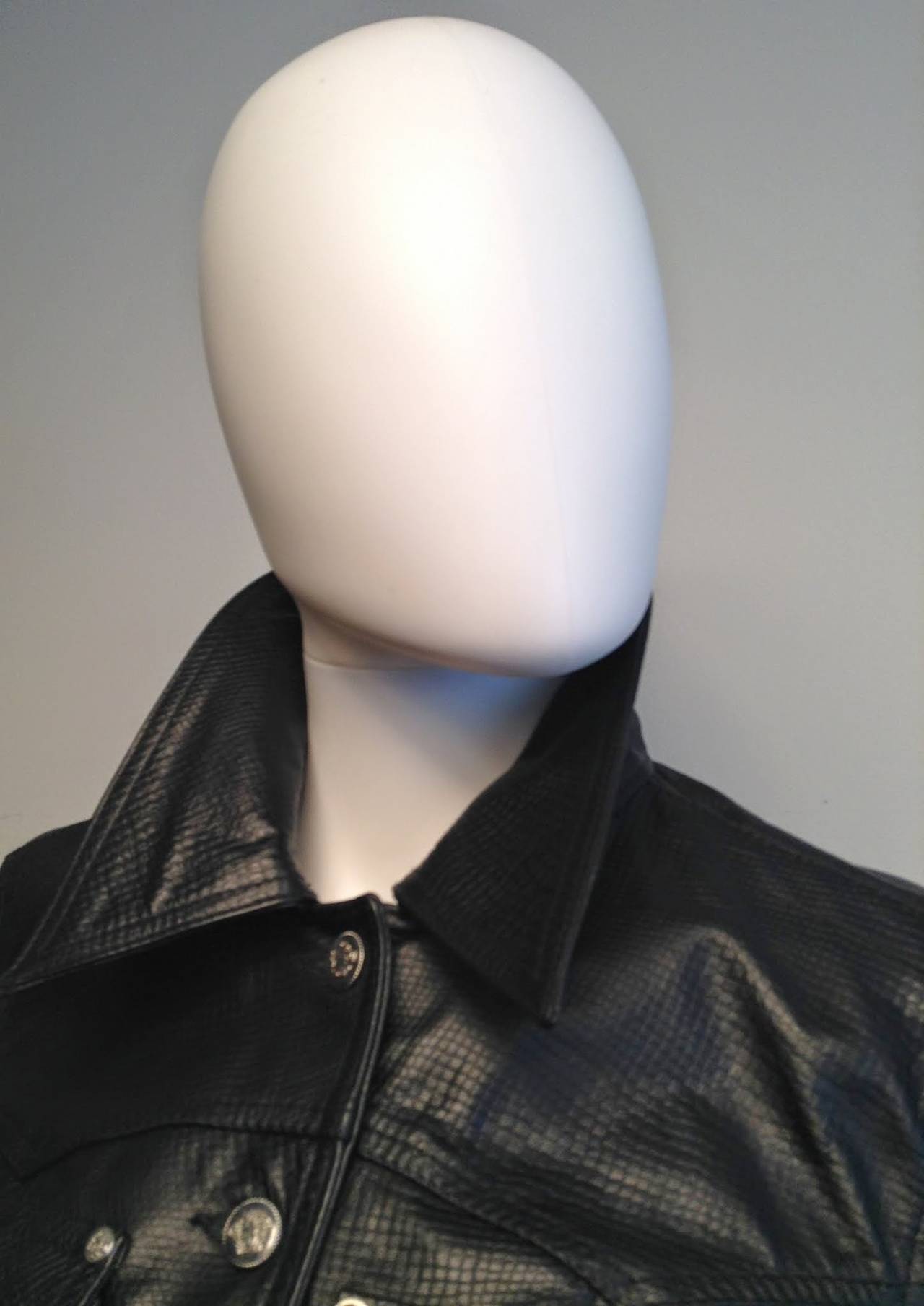 Sport the cropped look to the max with this outstanding leather jacket from Versace Jeans Couture jacket. 

Unworn, circa mid 90s. Piece # 090395

Measurements: Waist 28