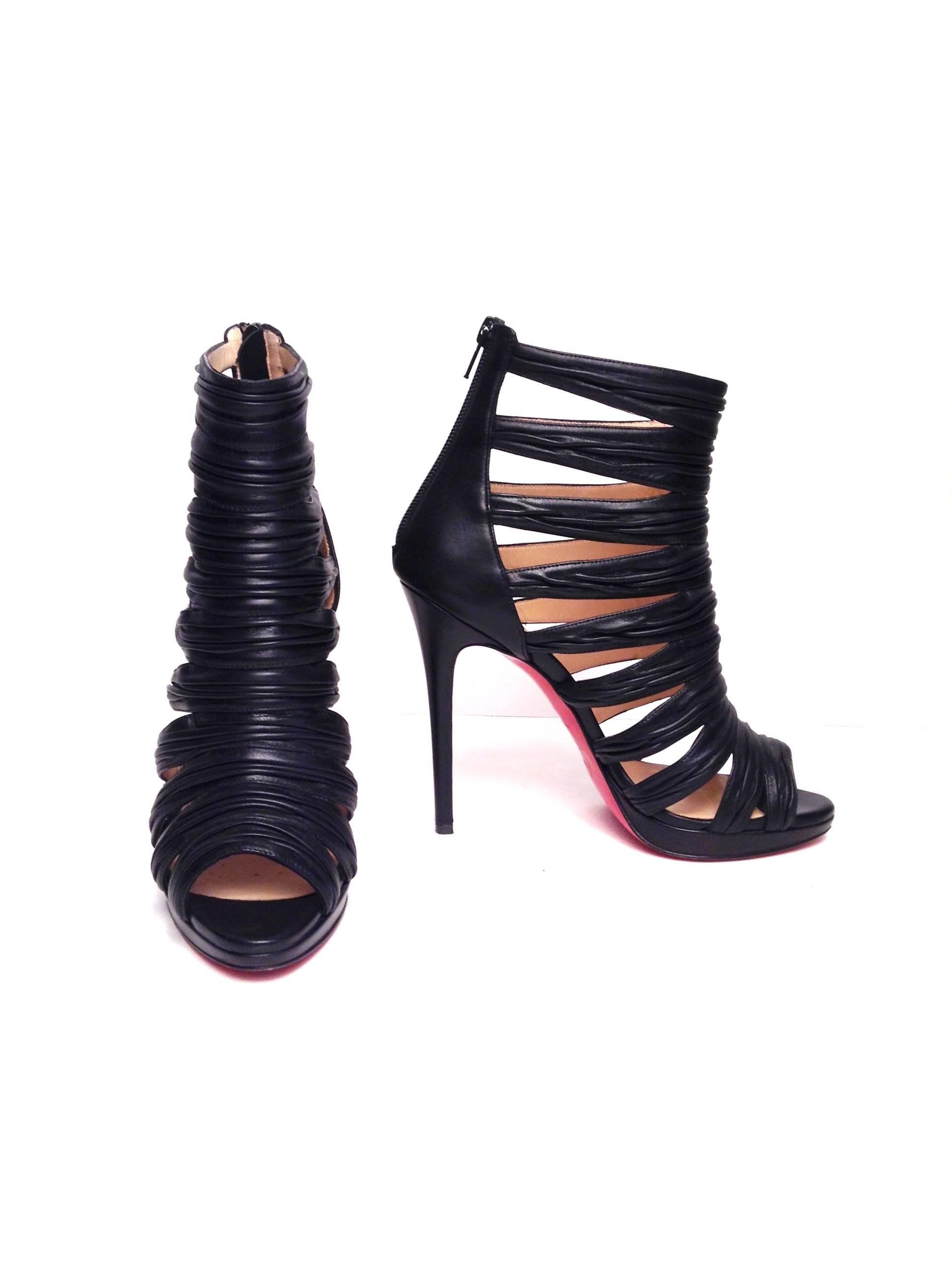 Gorgeous leather from Italy with rows of gathered straps and black zip closure for a cohesive look.

Self-covered heel, 4¾