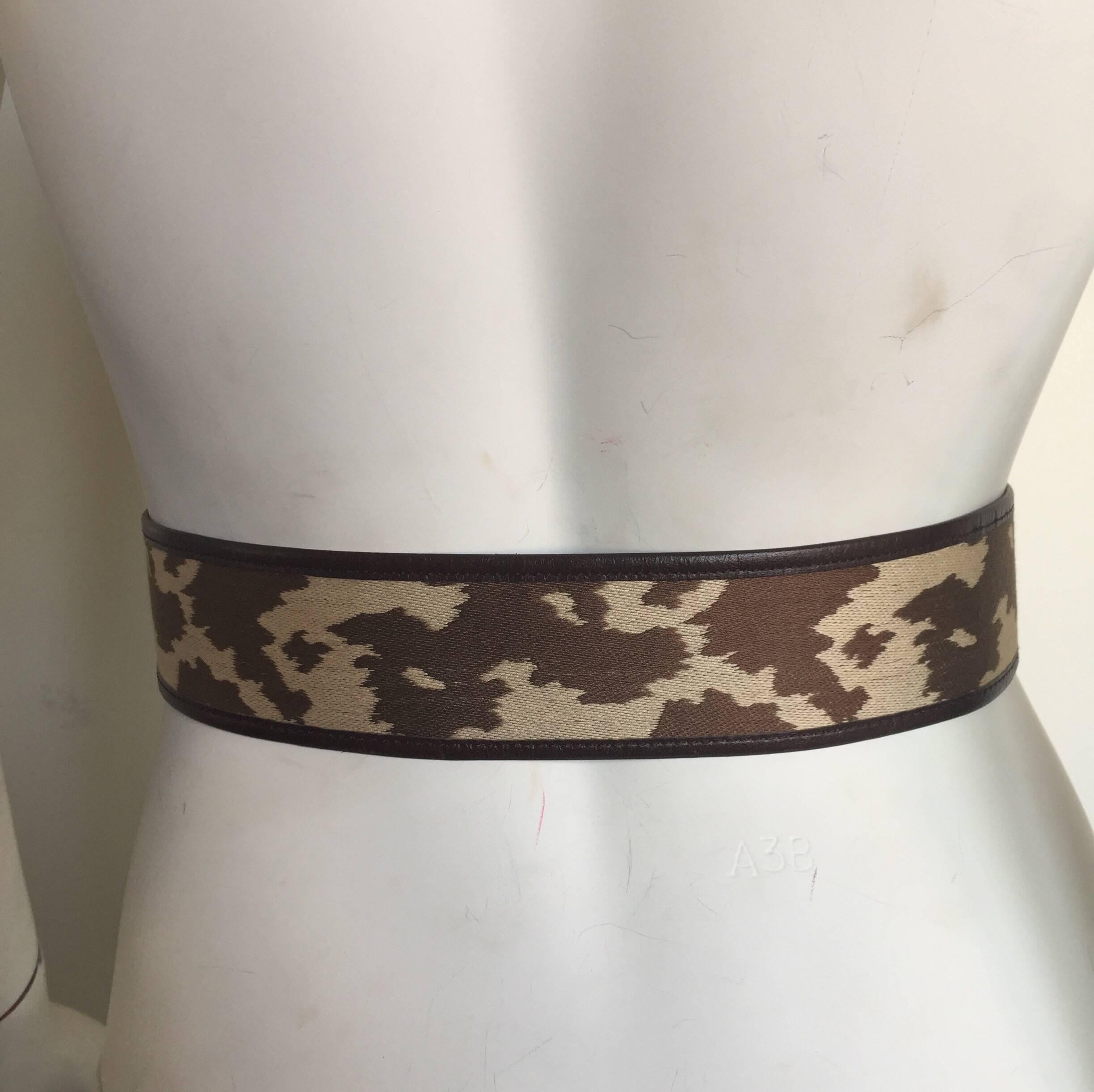 This cloth and leather belt is easily adjusted to the perfect size with a loop buckle closure.  This belt fits best on the high waist. 