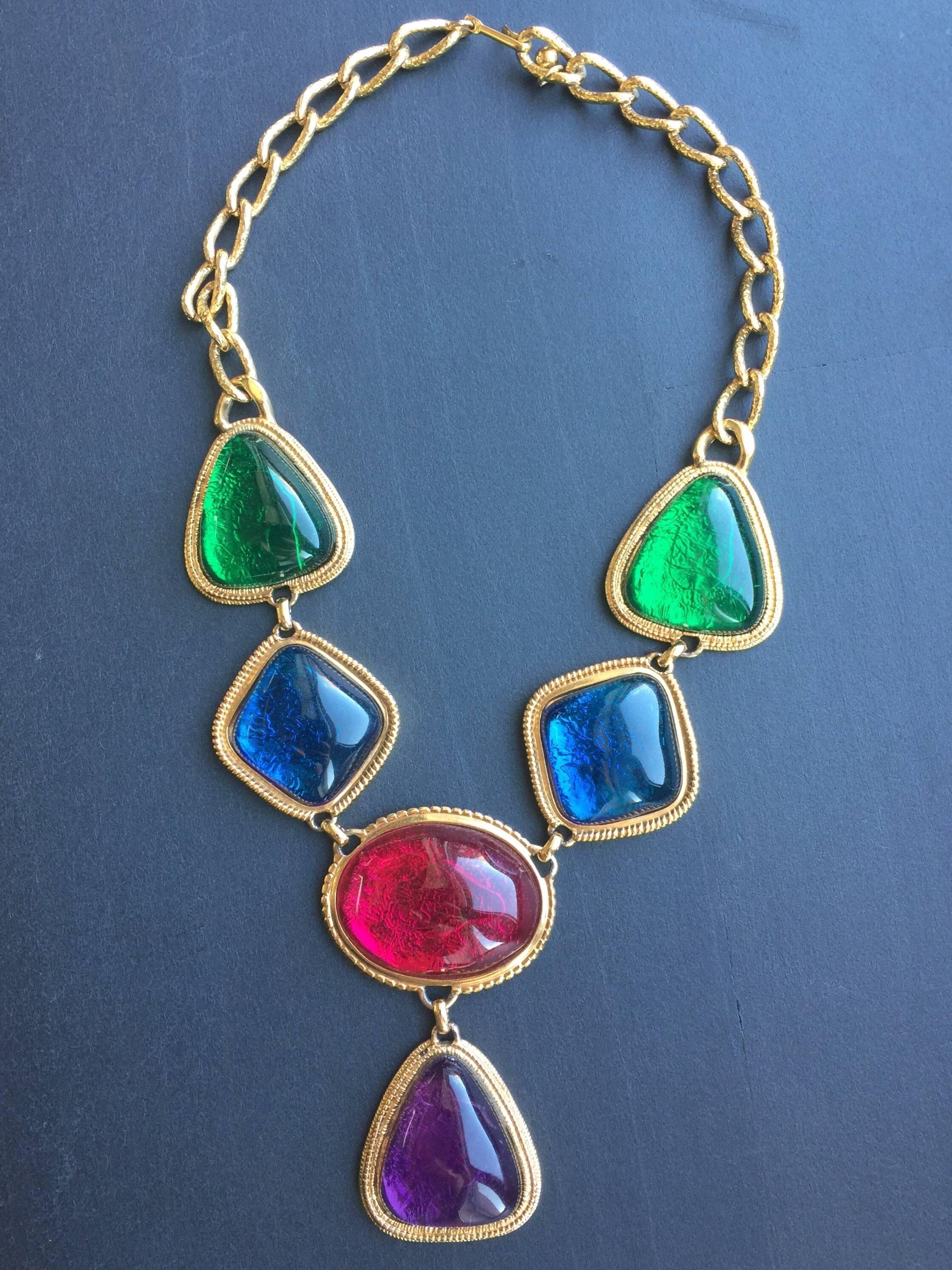 This KJL necklace is old tone with jewel tone stones.  Each stone is about 1 1/2" and the drop is  3 1/2 down from pink stone.