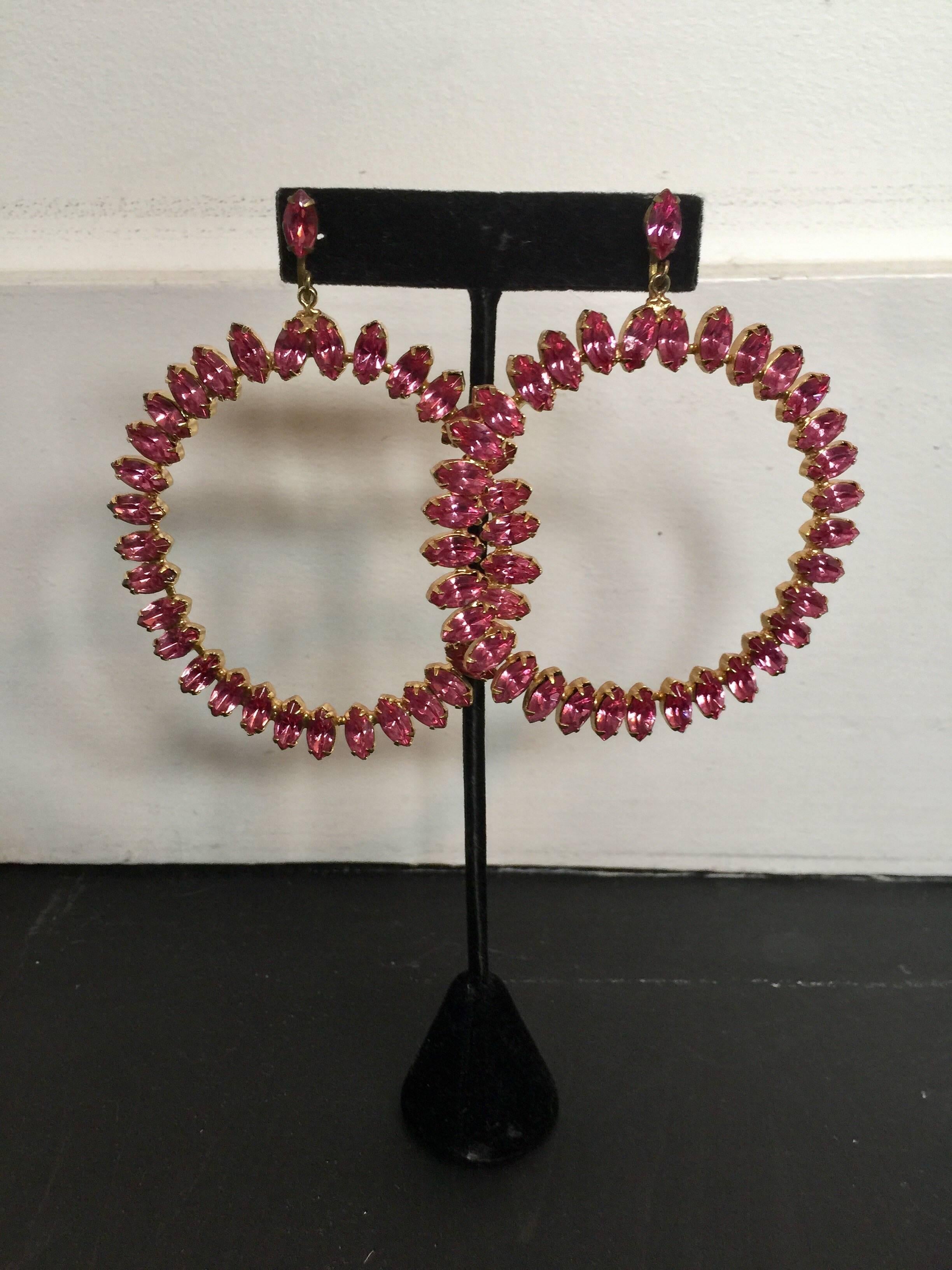 These bright pink crystal hoop earrings are 3 inches in diameter and very dramatic.  They are in good condition with no missing crystals.  I believe them to be unsigned Juliana.  they are clip on.