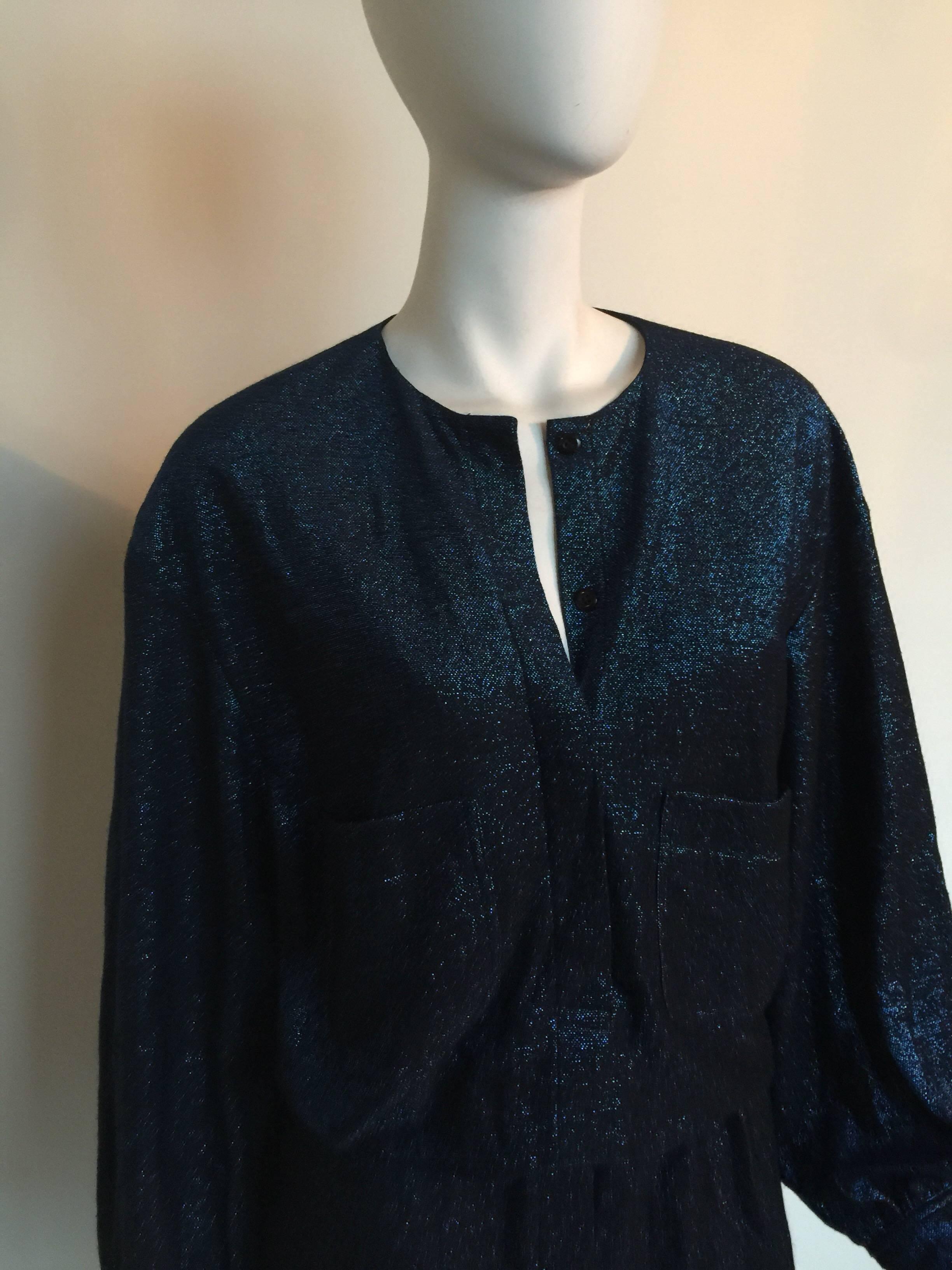 Giorgio di Sant'Angelo midnight blue sparkle dress is from the 1970s.  This metallic knit sweater dress has a drop elastic waist and two front pockets.  It fits a size L but could easily be tailored.  It is pinned in the first photo on the mannequin