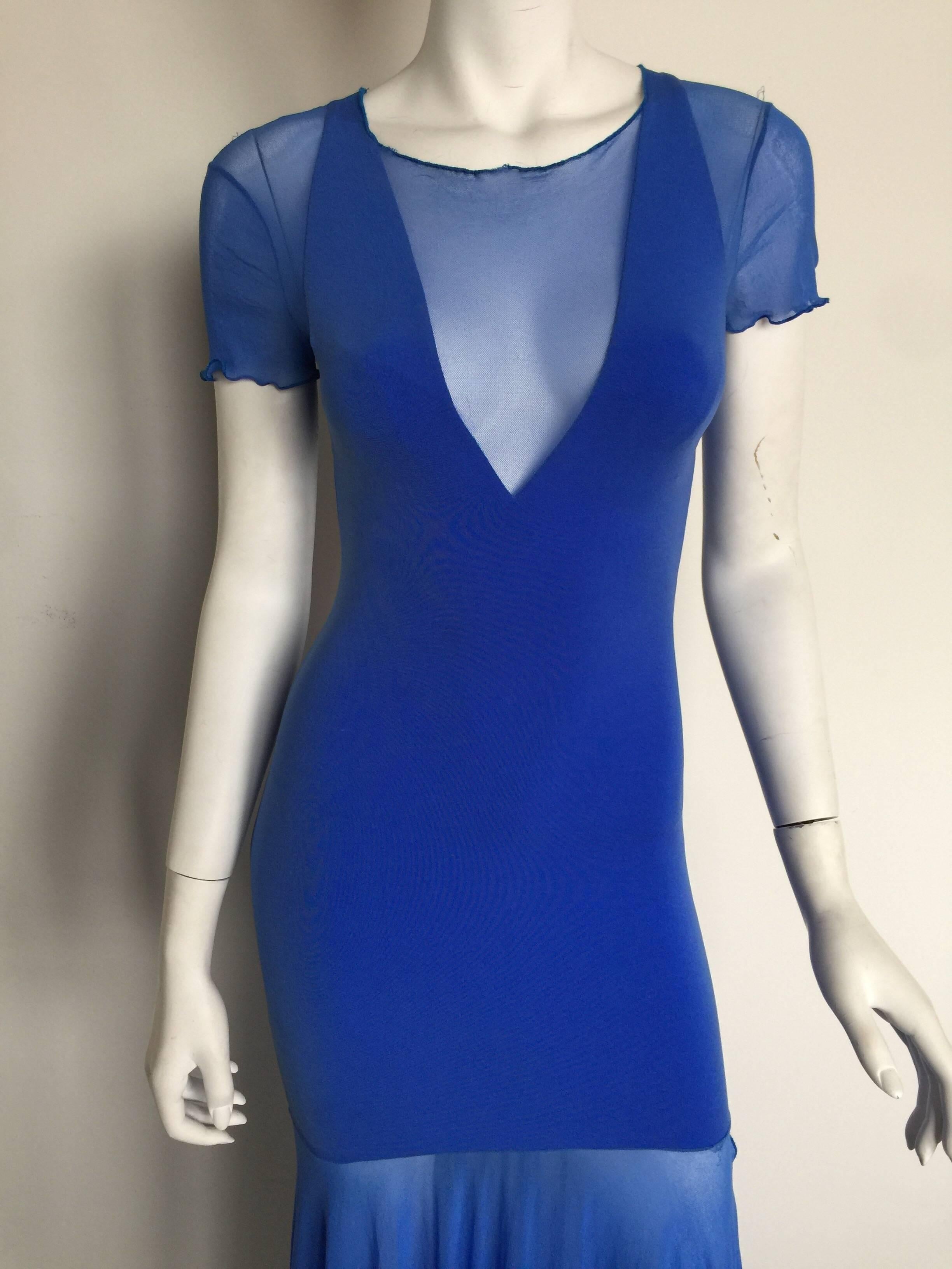 This Karl Lagerfeld sexy statement dress is from the 1980s.  It is form fitting with a deep V neckline and a scoop back.  It has breast pads that can be easily removed or kept for a little extra coverage.  The fabric has a lot of stretch so would