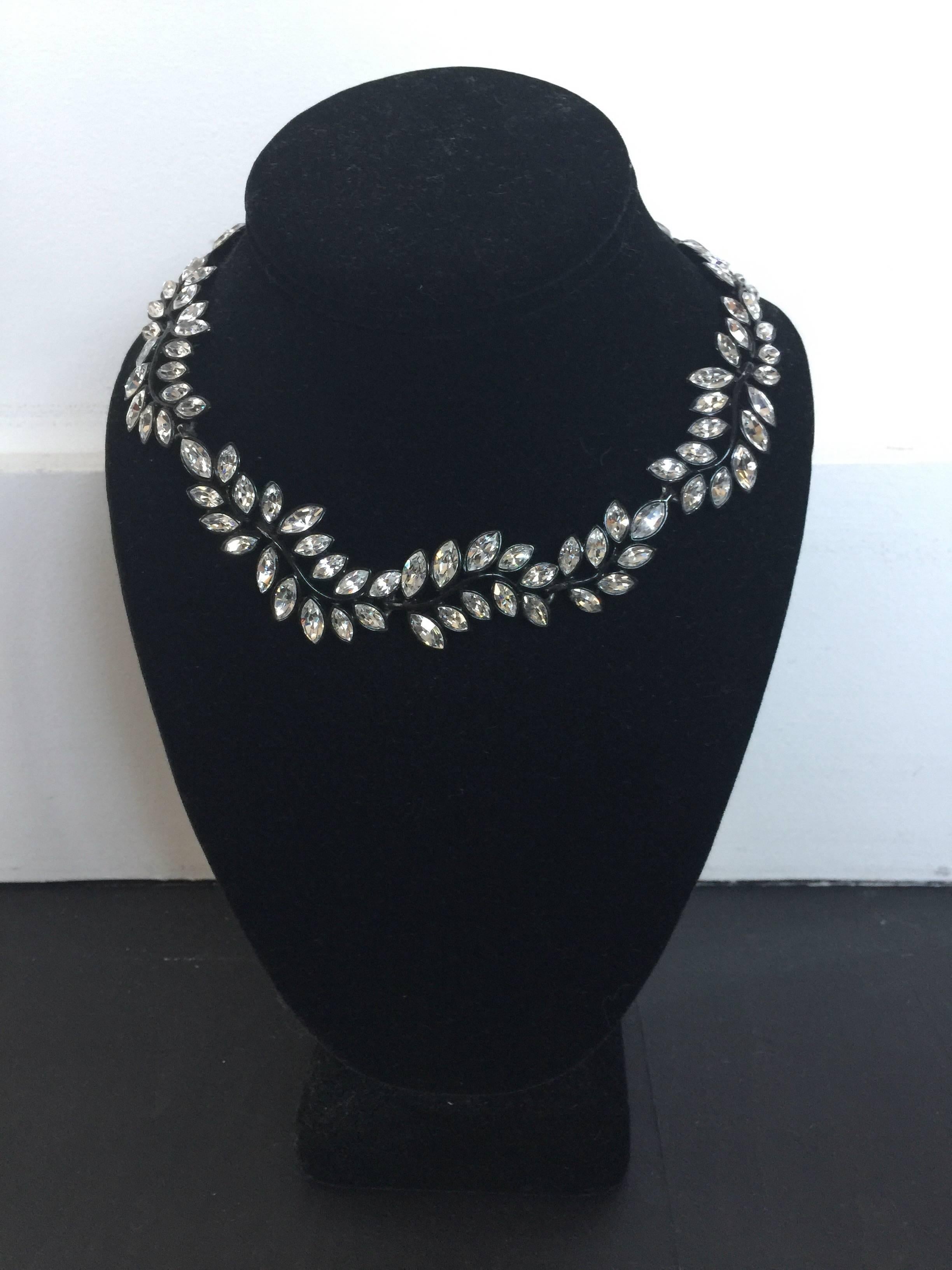 This KJL necklace is from early 20s.  It was from the KJL showroom but seems to be missing a signature.  It is blackened metal and crystal leaves and a great addition to any look.