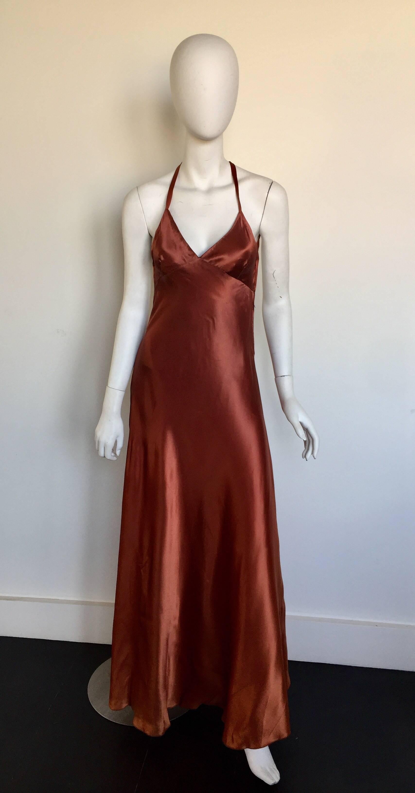 This is a stunning 1970s silk slip dress with a slight ombre effect and a bias cut skirt.  It is in good condiontion except for the inside lining looks a little unfinished.  It is a custom piece from a NY atelier and fits a 2-4 but please check