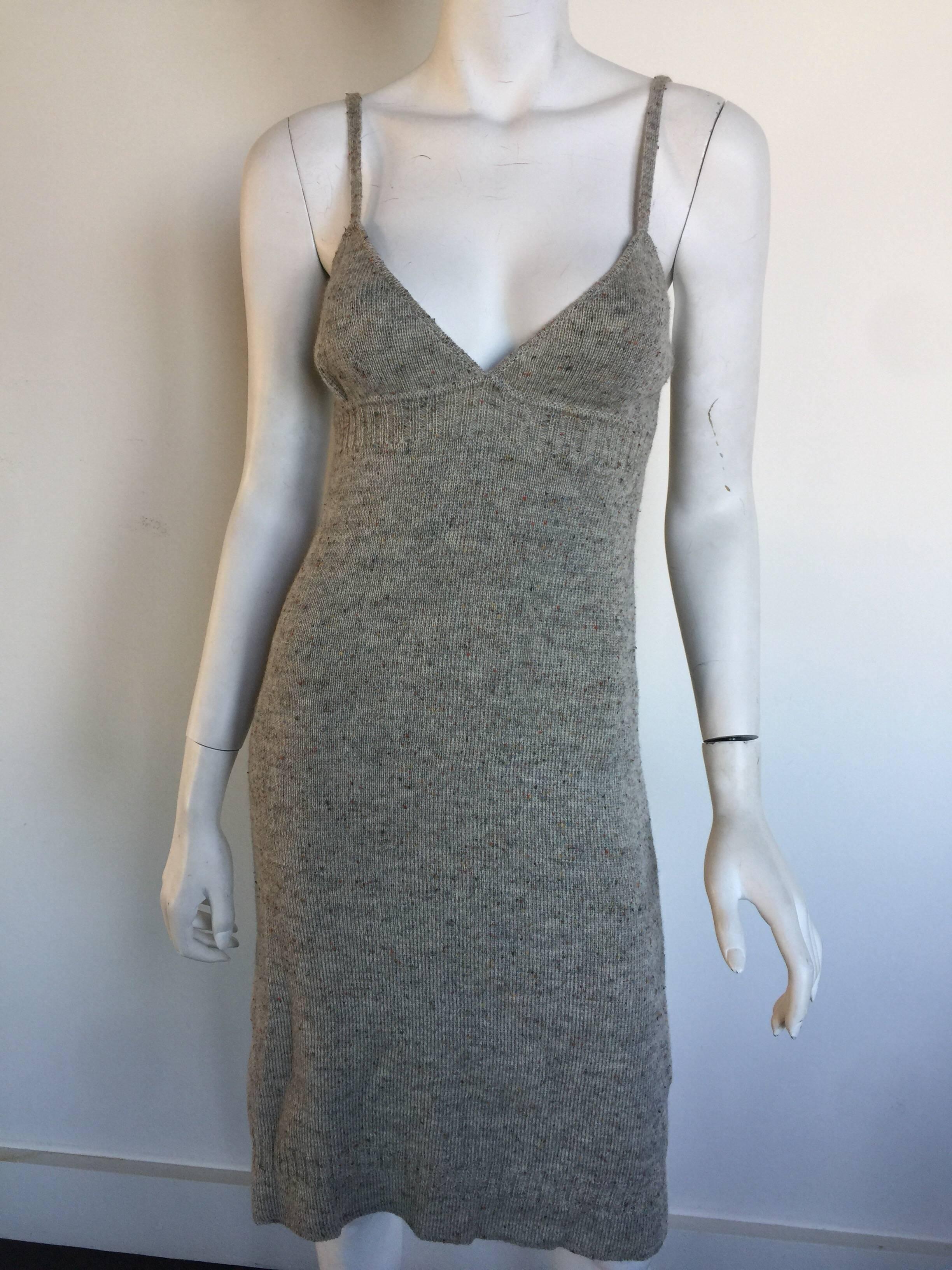 This grey knit Miu Miu dress is from the early 2000s.  It is in great condition and is missing size label but fits a 0-4.  The knit has a little bit of stretch.