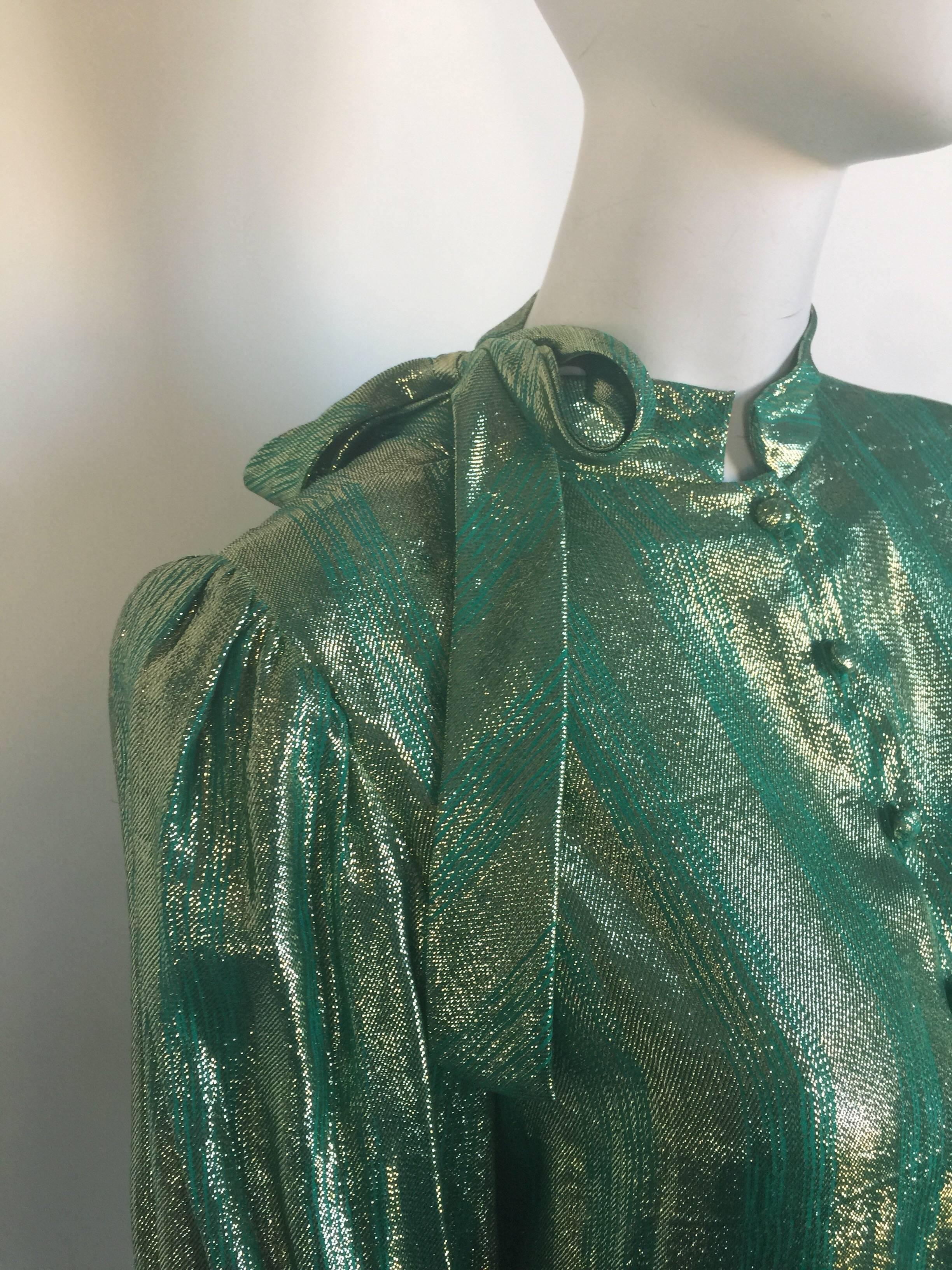 This metallic green Adolfo blouse has back pleated and a tie neck.  