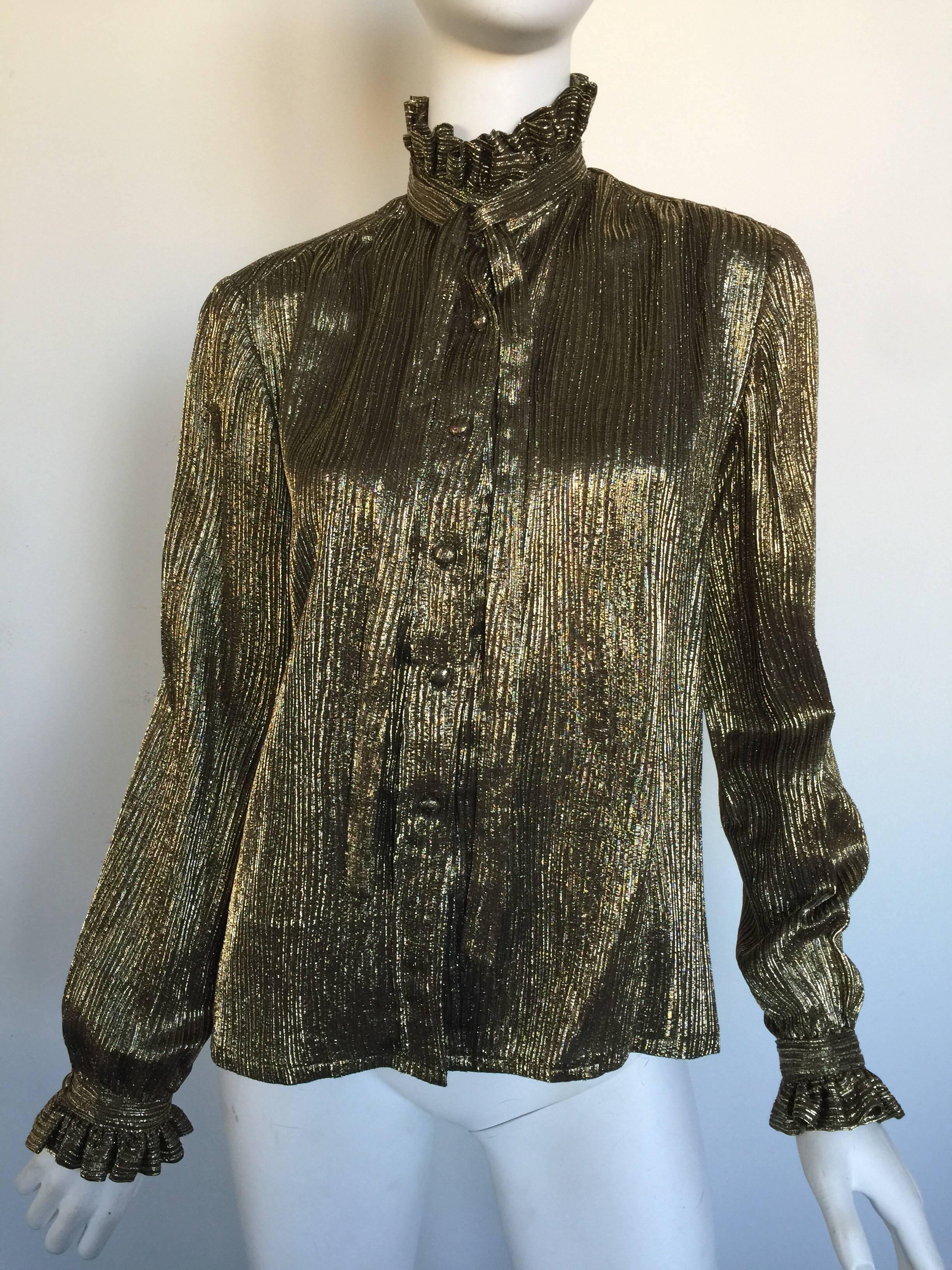 This gold metallic Adolfo blouse is 1970s for Saks Fifth Avenue.  It is pleated with a ruffle high neck and cuffs.  It has a matching skirt but can be purchased separately.  