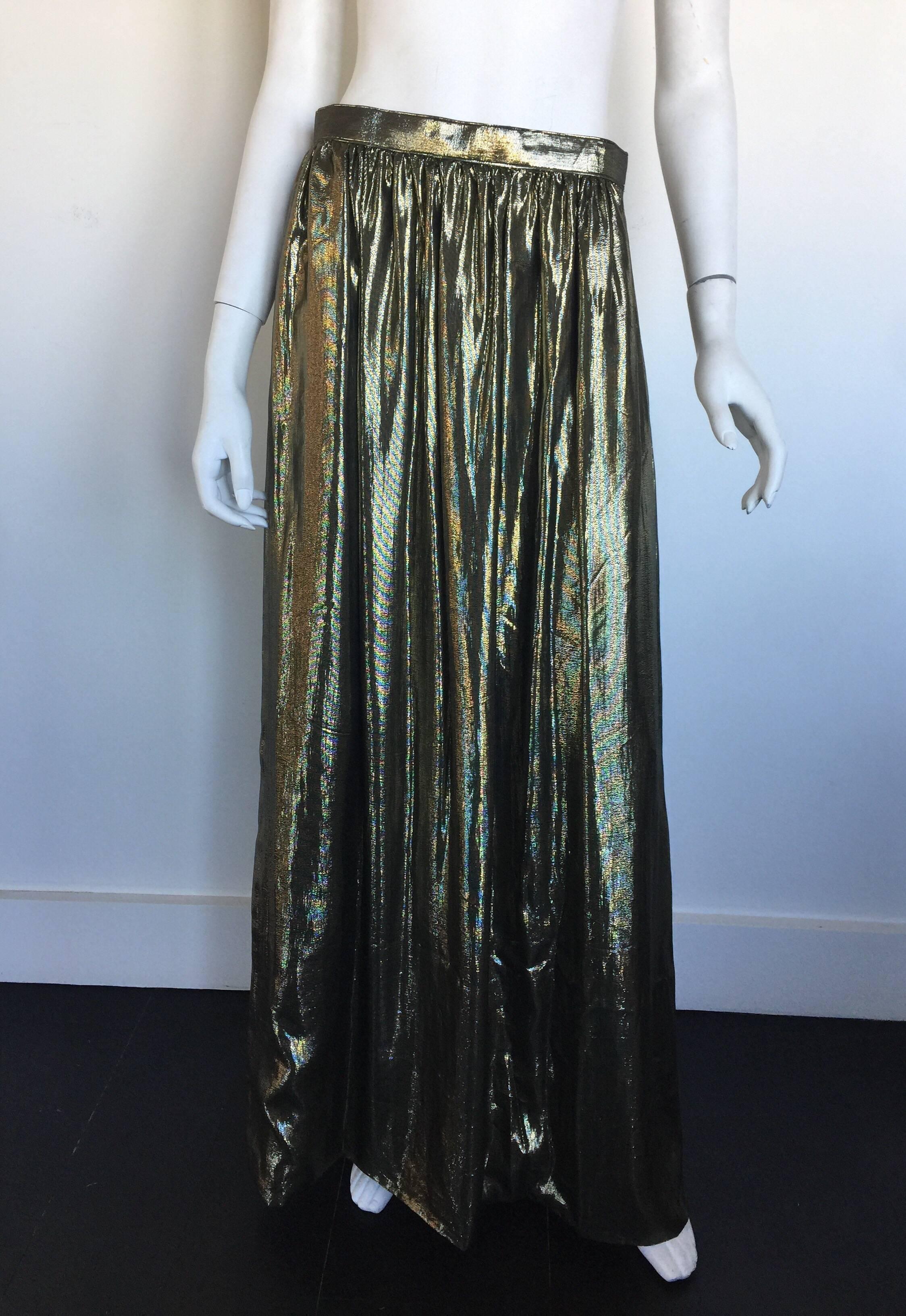 This Adolfo gold lame skirt is from the 1970s.  It has one side pocket and a side closure. 