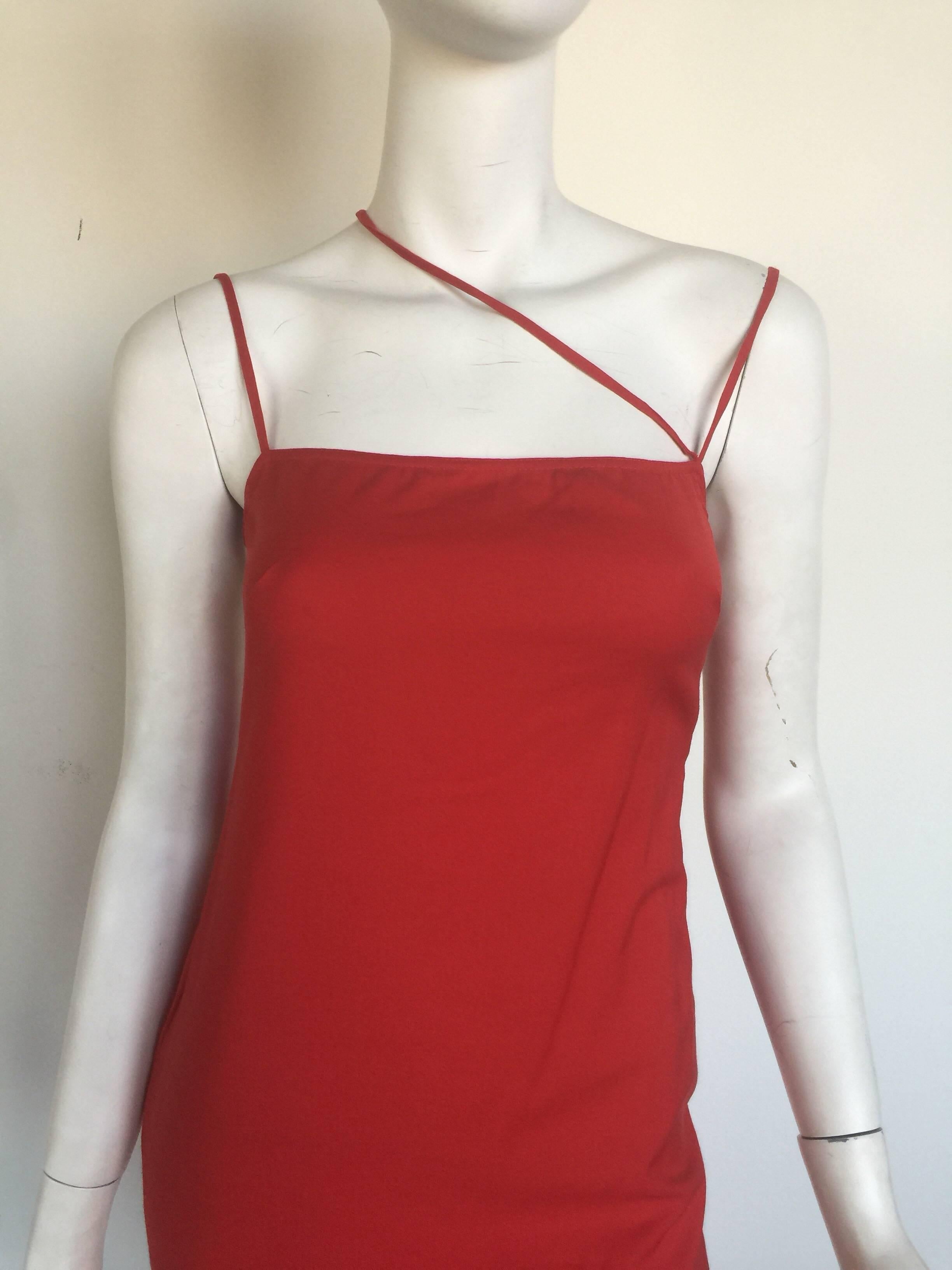 This Gianni Versace red mini dress has a scrappy back and shoulder details.  It is listed a size 38 and pretty true to size but please check measurements.  