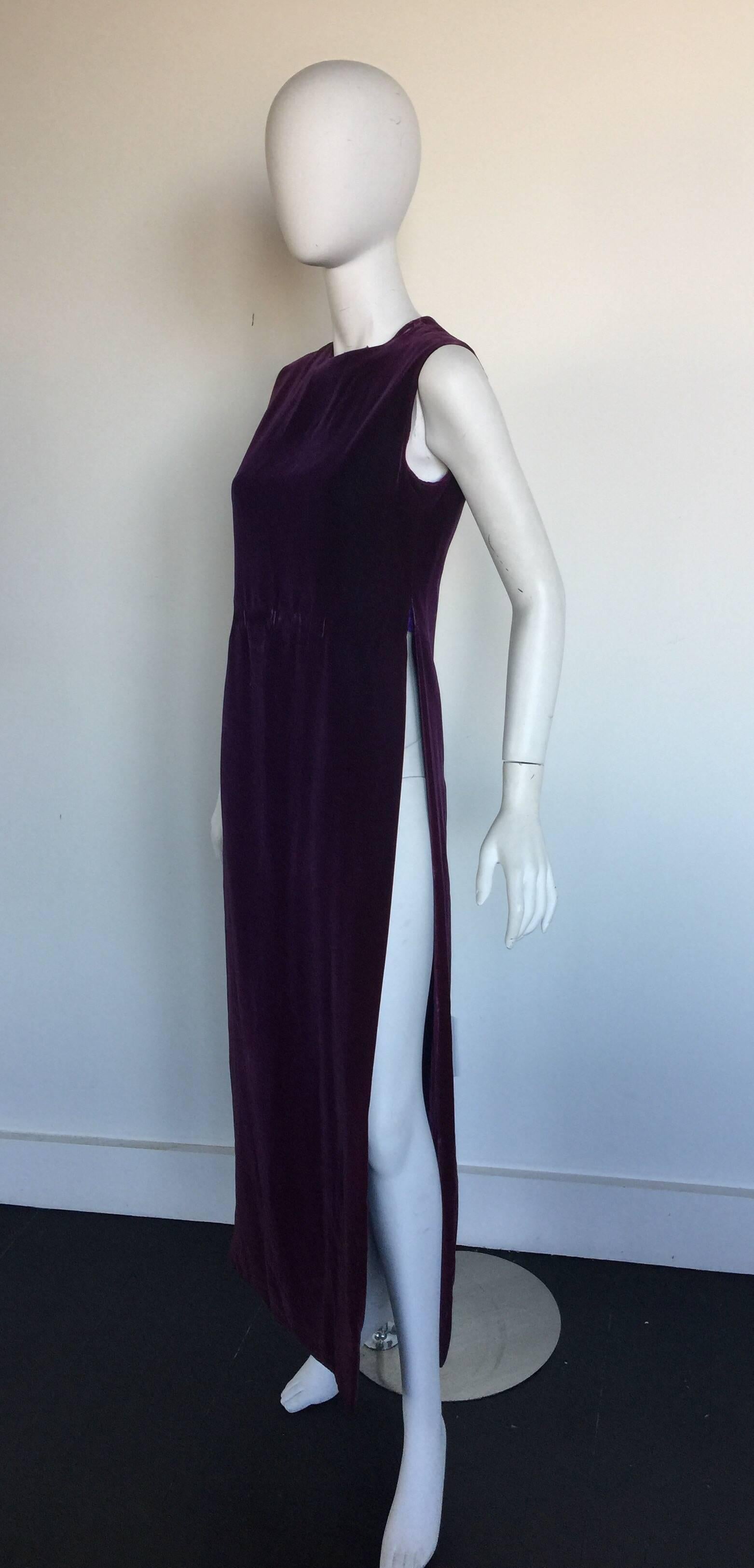 Deep Purple velvet caftan with 38 inch side slit on both sides reaching to just below the bra line.  This Pierre Cardin piece is from the 1960s.  It can be worn over a dress or pants or even small shorts/mini skirt