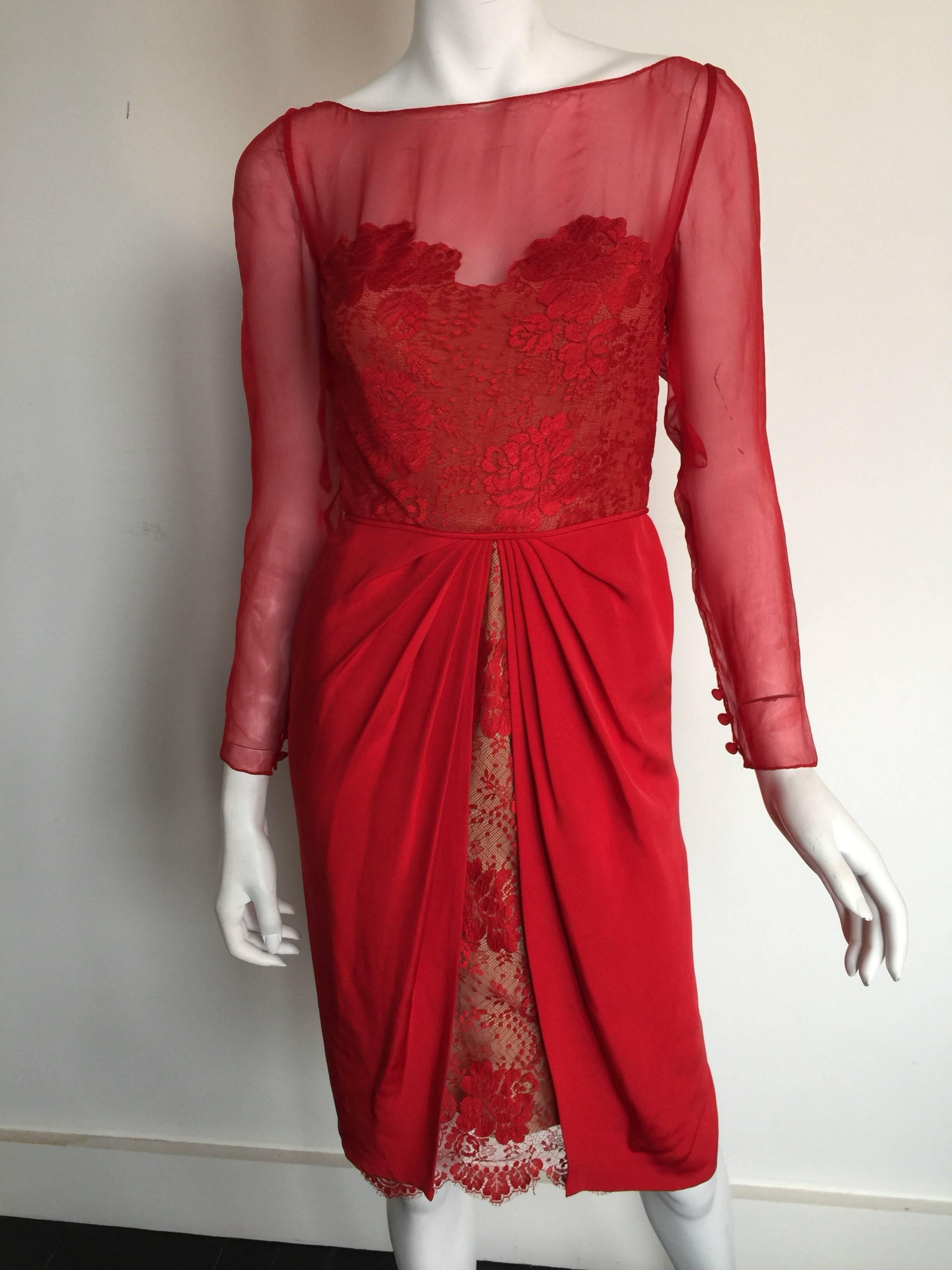 Stunning red silk, chiffon and lace overlay dress.  The neckline has a boatneck and there is a double zipper in the back as shown. 