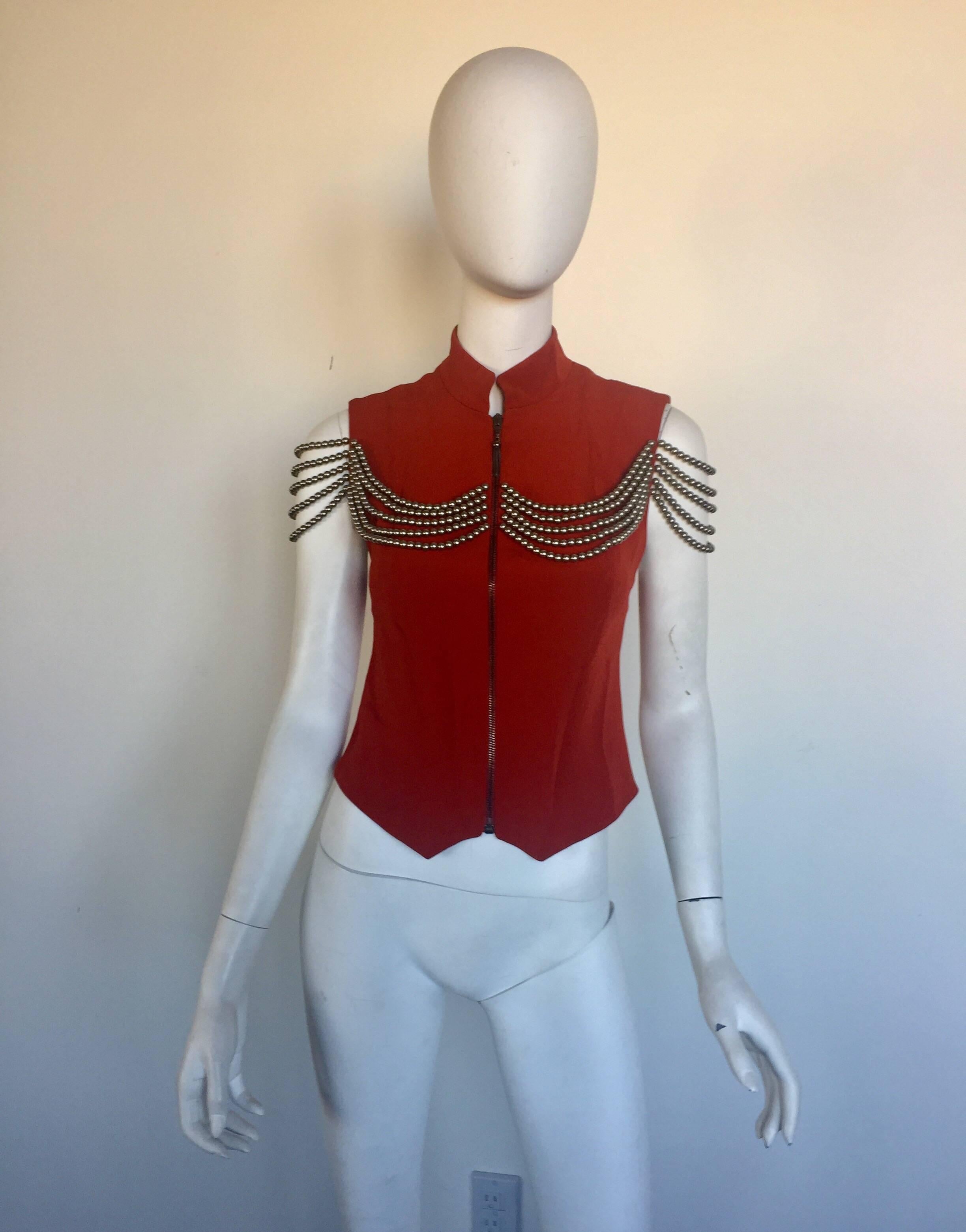 This rare Ozbek vest is a deep red acetate rayon mix vest with gunmetal colored beads across the shoulders.  It is a size 40/6 but fits small so please check measurements. 