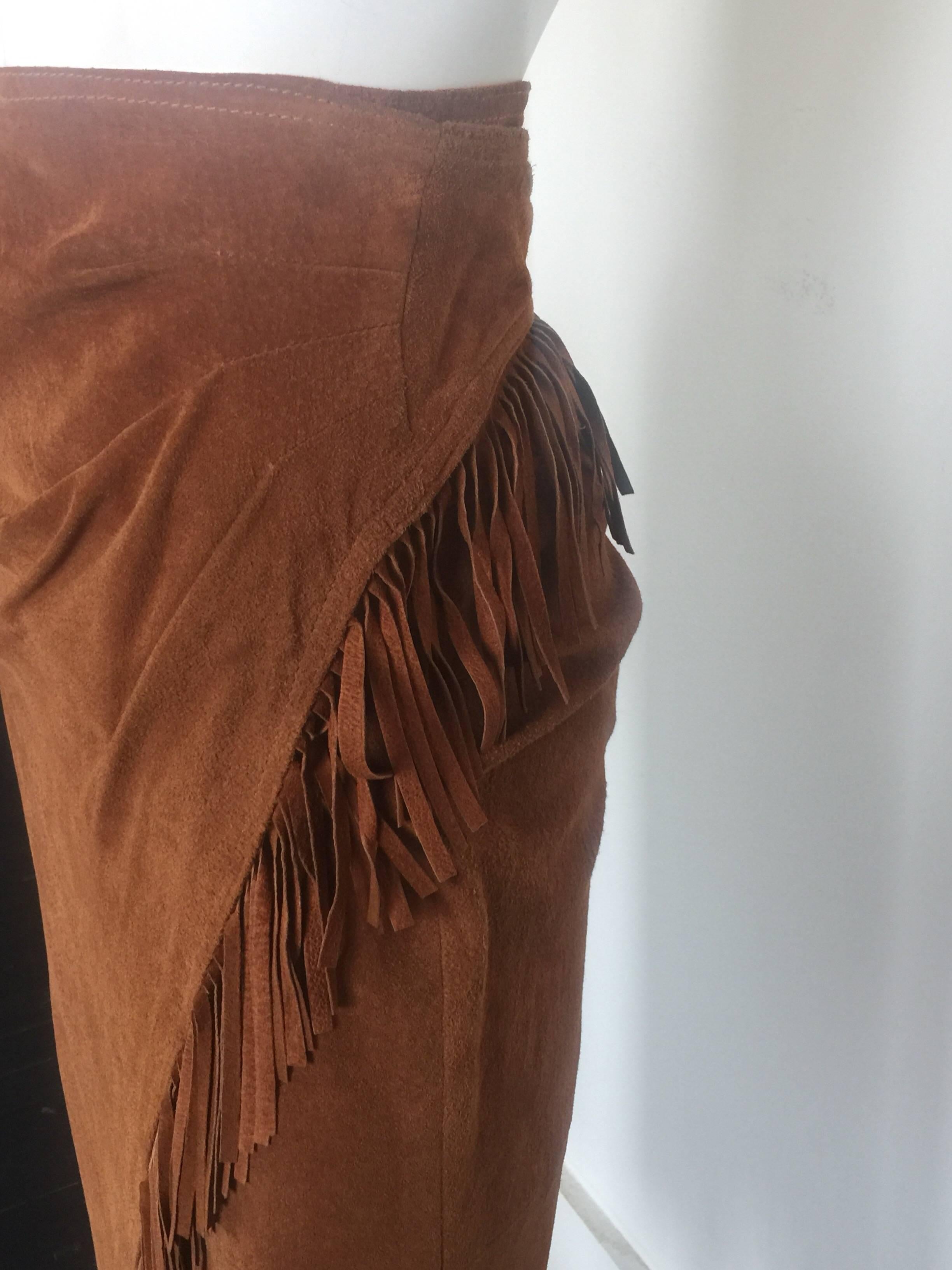 This 100% leather suede fringe skirt is a size M but because of wrap style can fit multiple sizes. 